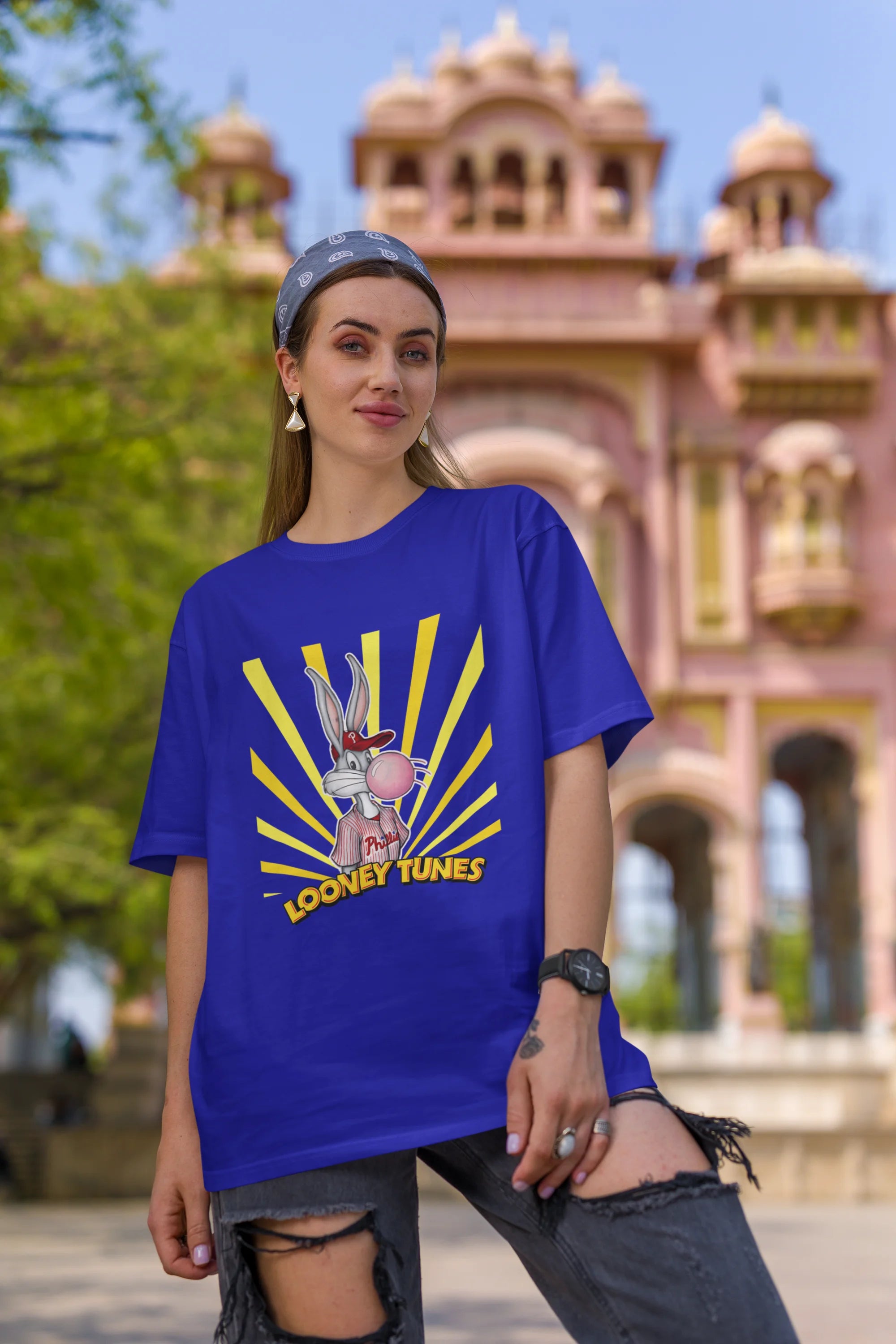 First image of female Model showcasing blue Bugs Bunny oversize t-shirt from Looney Tunes, featuring a bold Bugs Bunny design