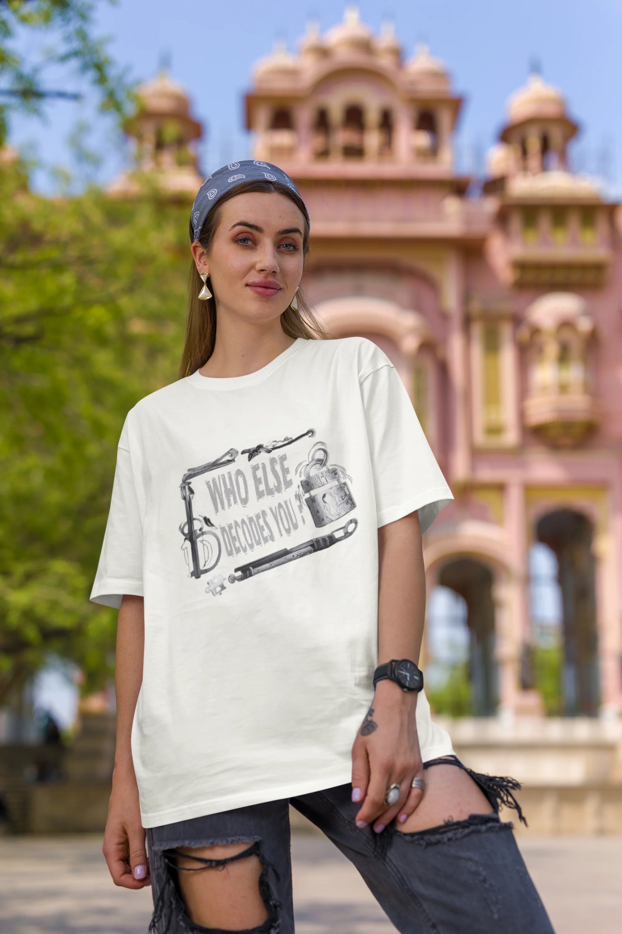 First image of woman wearing off white coloured Oversized Taylor Swift T-Shirt featuring TTPD inspired design.