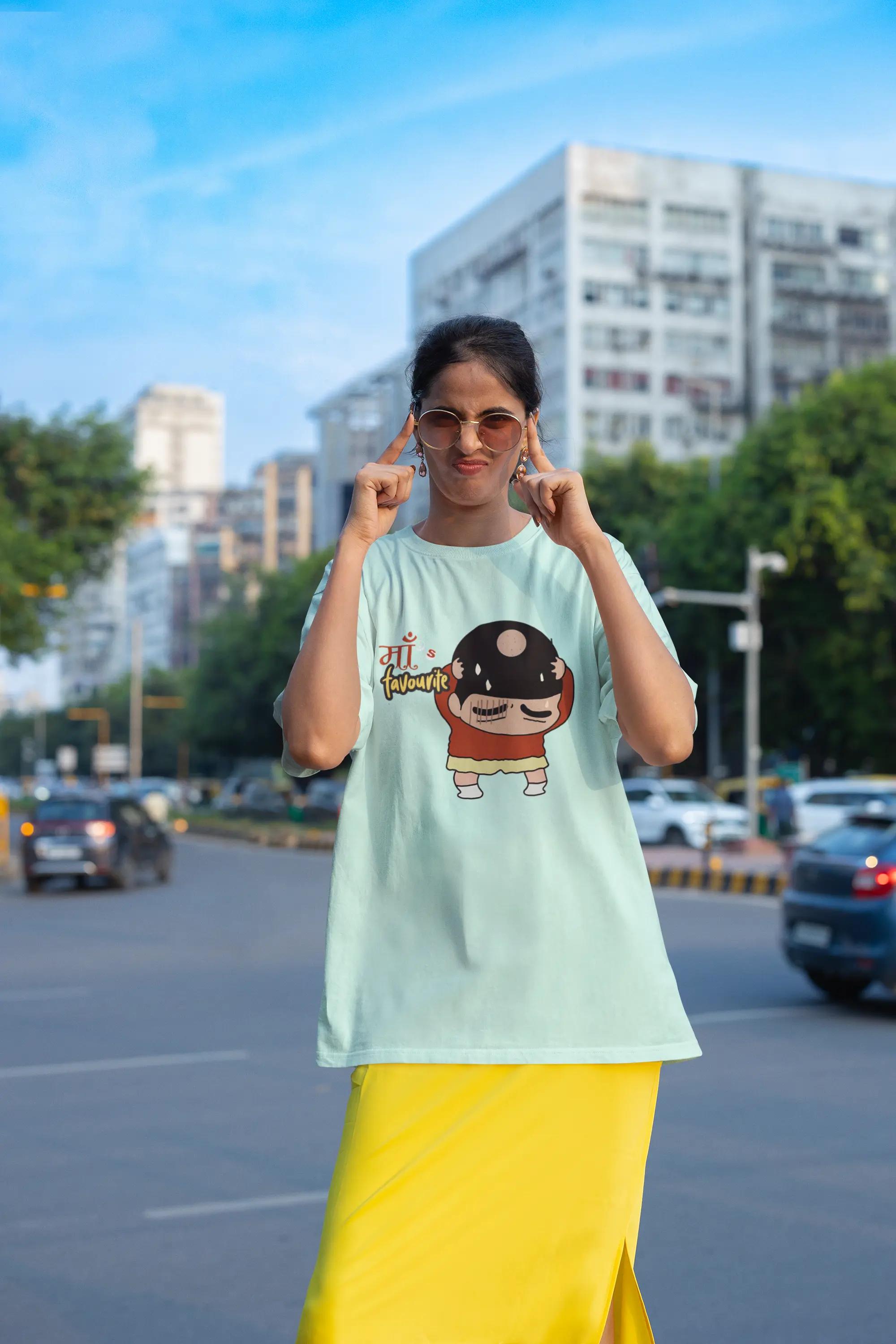 Third front view of female model wearing a mint green oversized tee featuring Shinchan with a classic bump on his head. A perfect blend of humor and nostalgia for Shinchan fans.