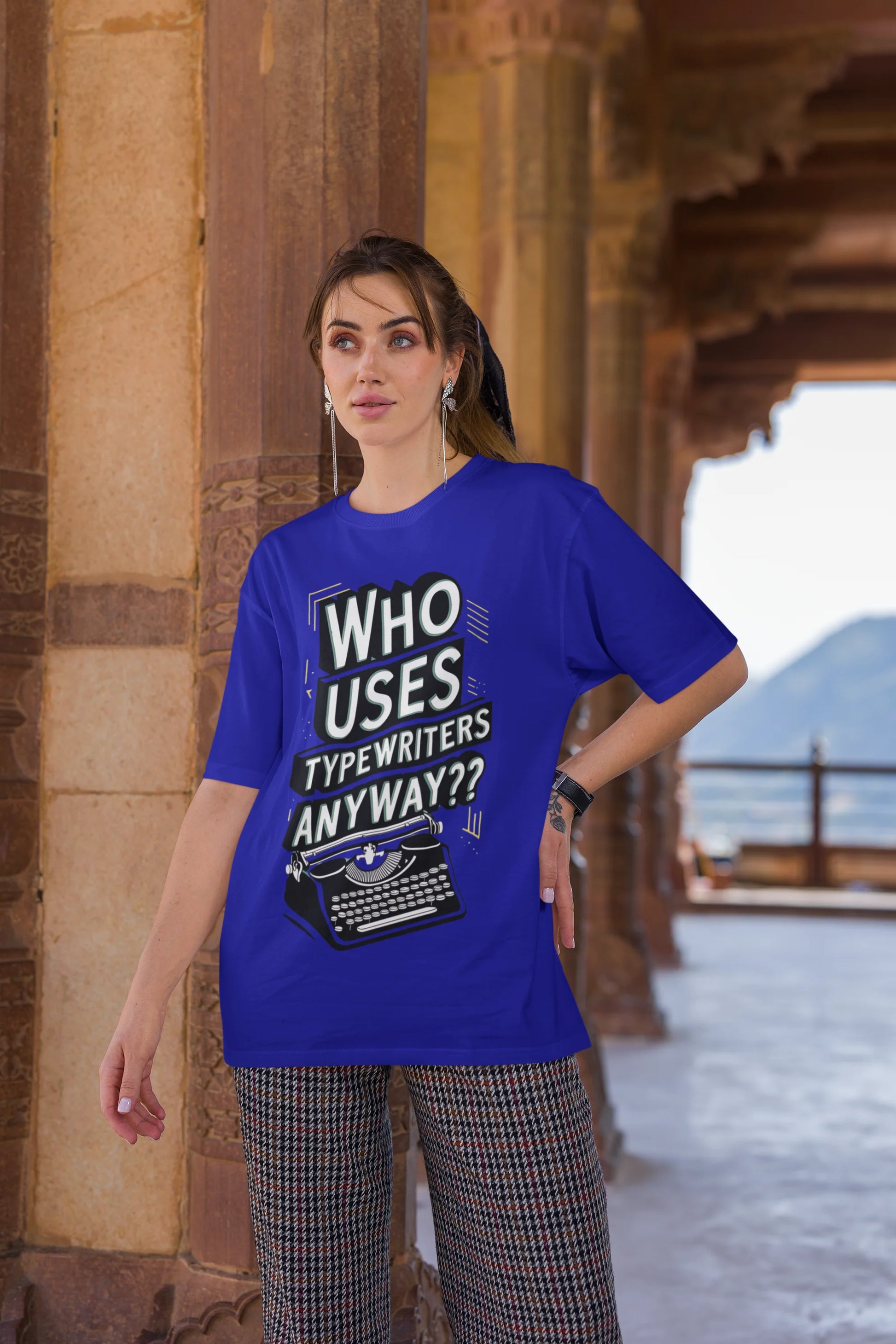 Third Image of a woman wearing blue Oversize t-shirt featuring TTPD design inspired by Taylor Swift's Eras Tour.