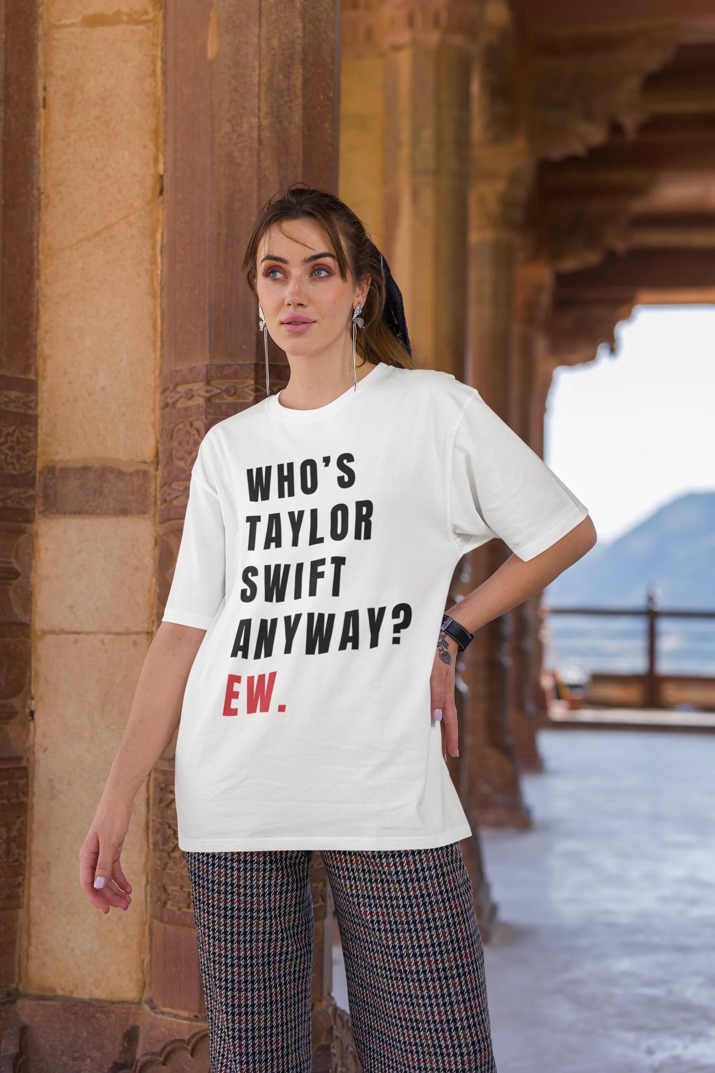 Second image of Woman wearing Taylor Swift Red-themed oversized tee, showcasing iconic eras tour merch and Taylor's Version nod