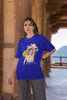 Third front view of female model wearing a royal blue oversized t-shirt with a positive message 