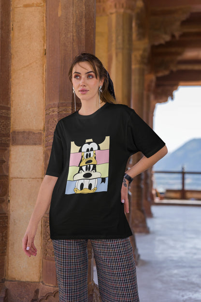 Third image of female Model showcasing black oversized t-shirt inspired by Mickey Mouse Clubhouse characters: Mickey Mouse, Donald Duck, Goofy, and Minnie Mouse
