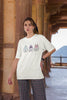 Third image of female model wearing Disney-themed off-white oversized tee with a cute cartoon design