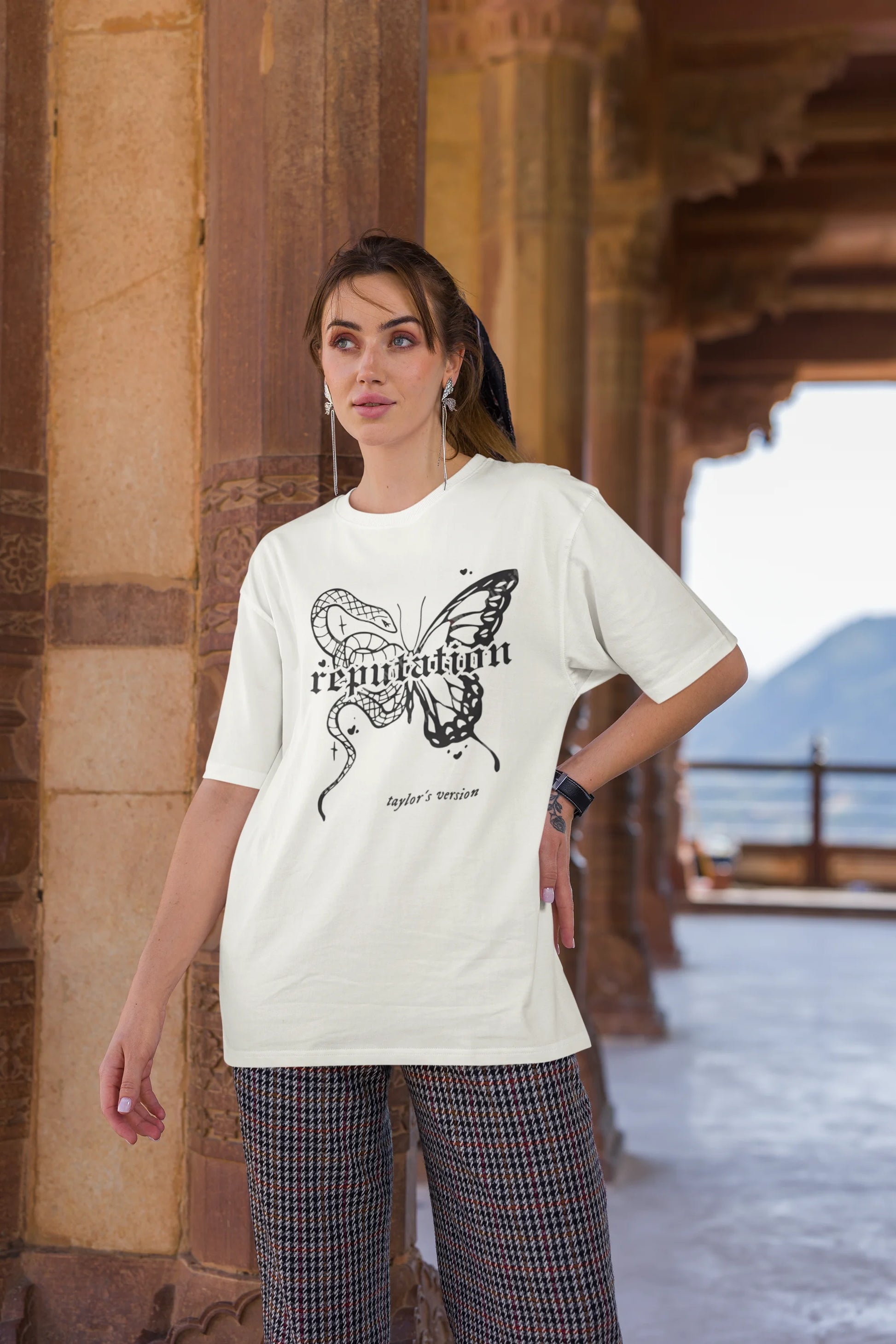 Third Image of woman wearing white Oversize t-shirt featuring Reputation Taylor's Version design inspired by Taylor Swift's Reputation era