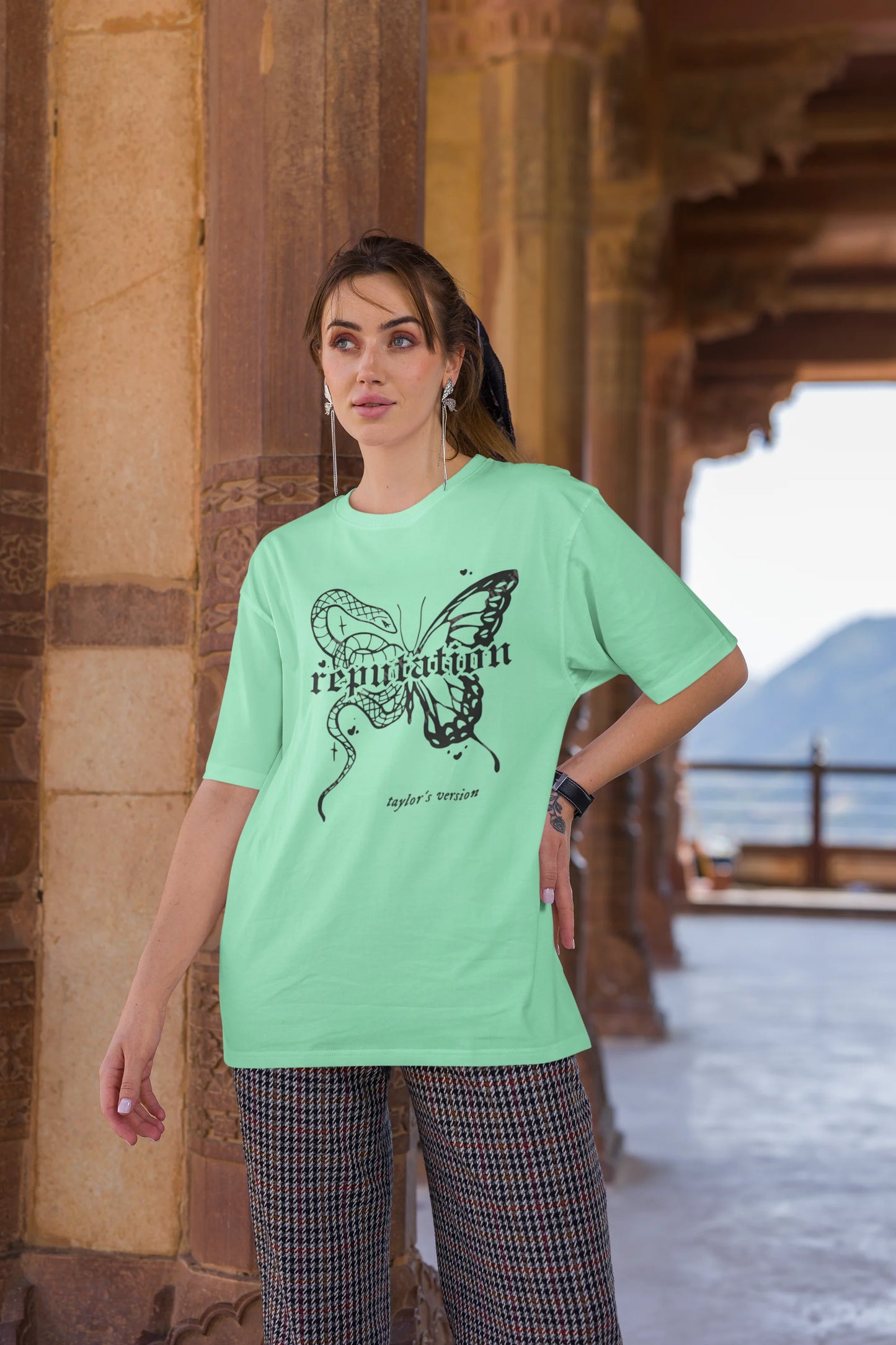 Third Image of woman wearing mint green Oversize t-shirt featuring Reputation Taylor's Version design inspired by Taylor Swift's Reputation era
