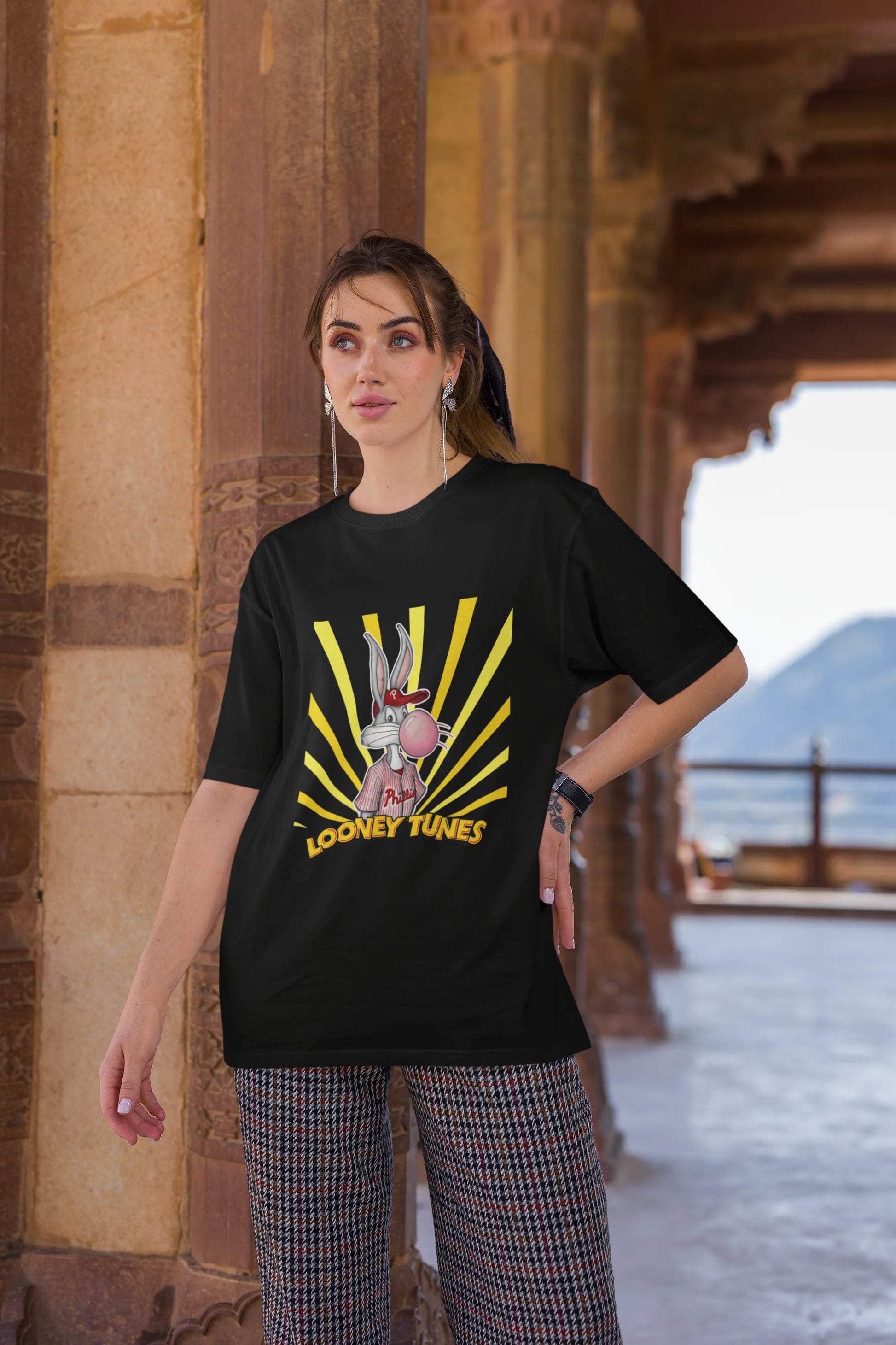 Third image of female Model showcasing black Bugs Bunny oversize t-shirt from Looney Tunes, featuring a bold Bugs Bunny design
