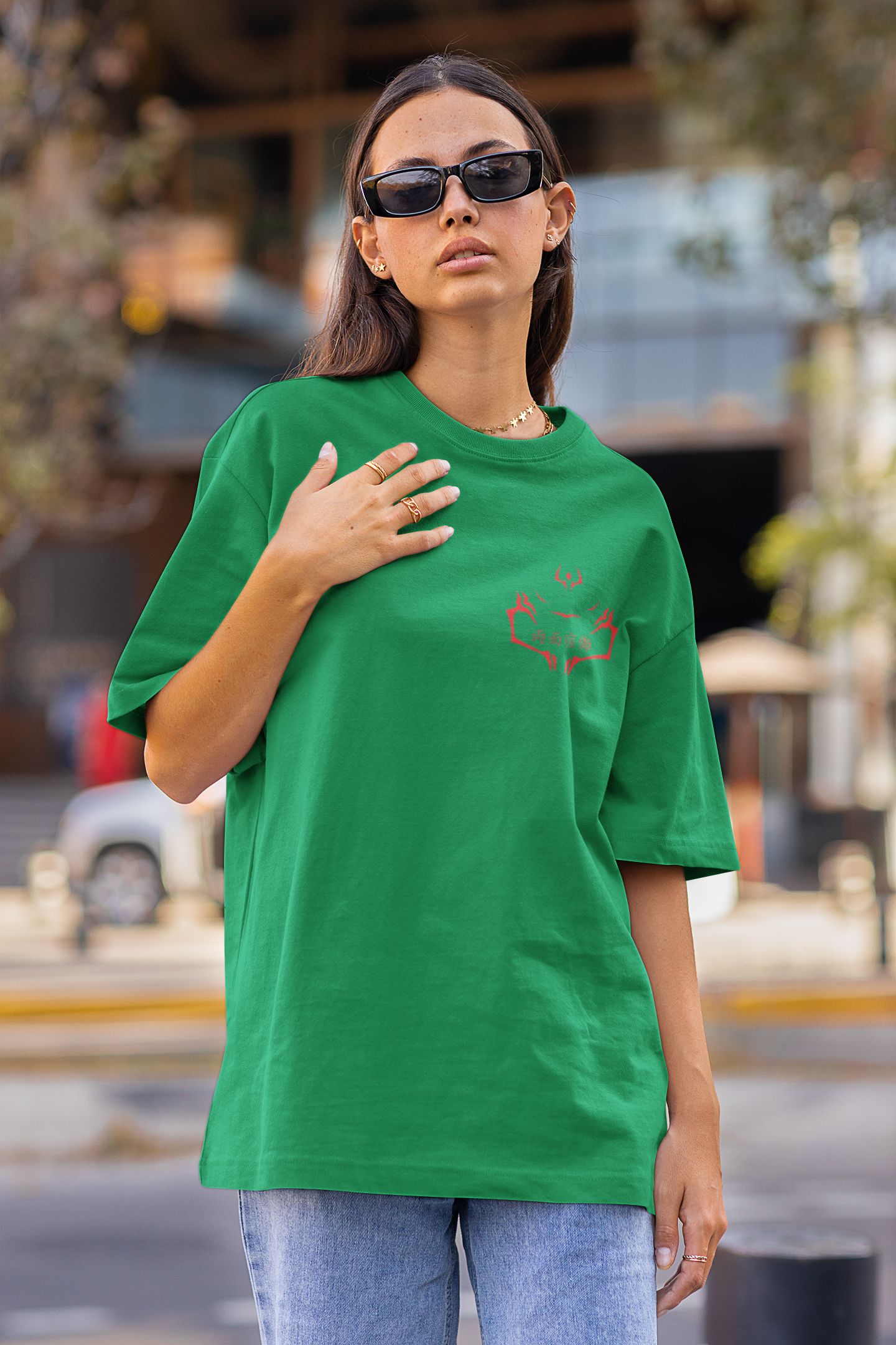 First front view of a female model wearing a forest green oversized t-shirt featuring Ryomen Sukuna with the text "I'm Sakuna."