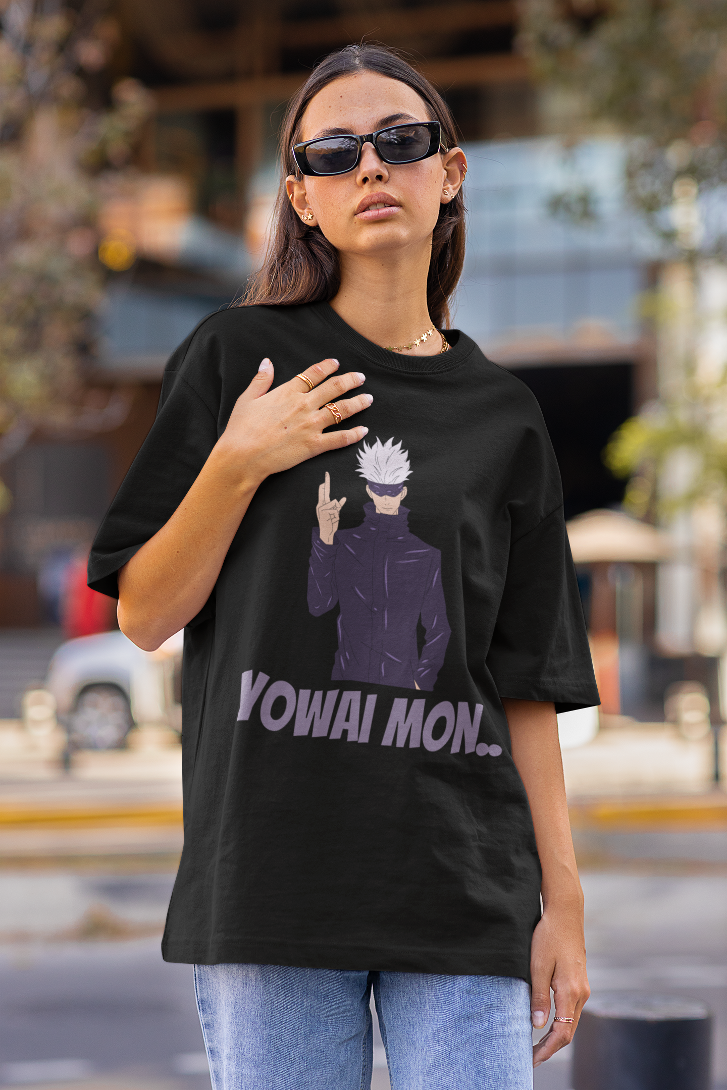 2nd front view of a female model wearing a black oversized t-shirt featuring Gojo Satoru with his fingers crossed and the text "Yowai Mon."