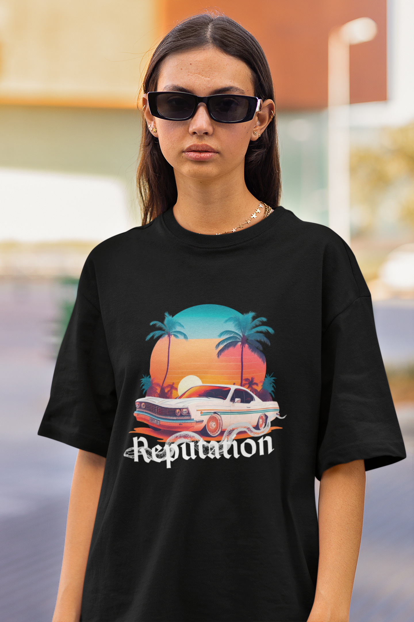 Close up front view of woman wearing black Oversize t-shirt featuring Reputation Taylor's Version design inspired by Taylor Swift's Reputation era