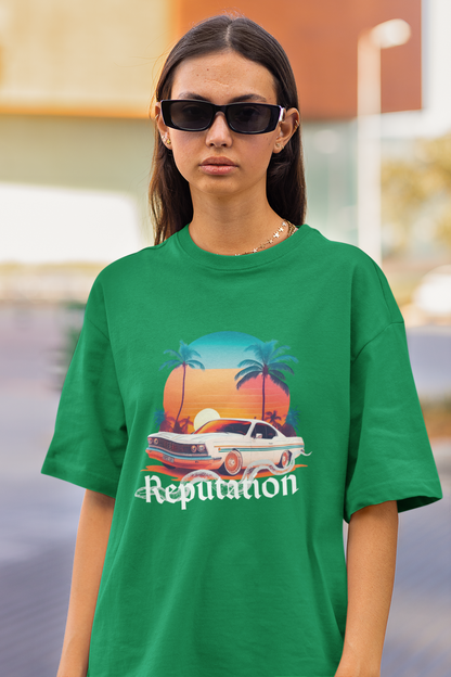 Close up front view of woman wearing green Oversize t-shirt featuring Reputation Taylor's Version design inspired by Taylor Swift's Reputation era