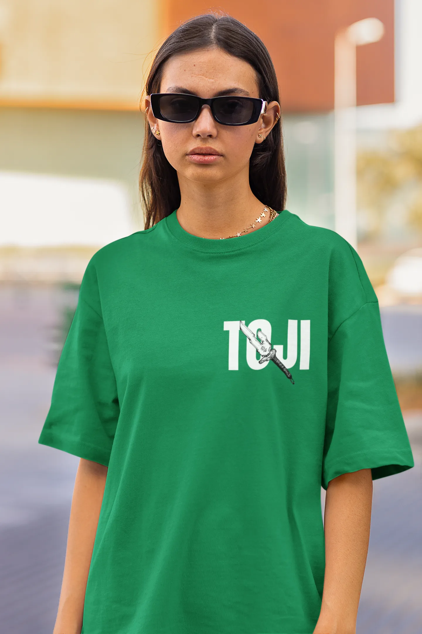 2nd front view of a female model wearing a forest green oversized t-shirt featuring Toji Fushiguro from the Jujutsu Kaisen anime.