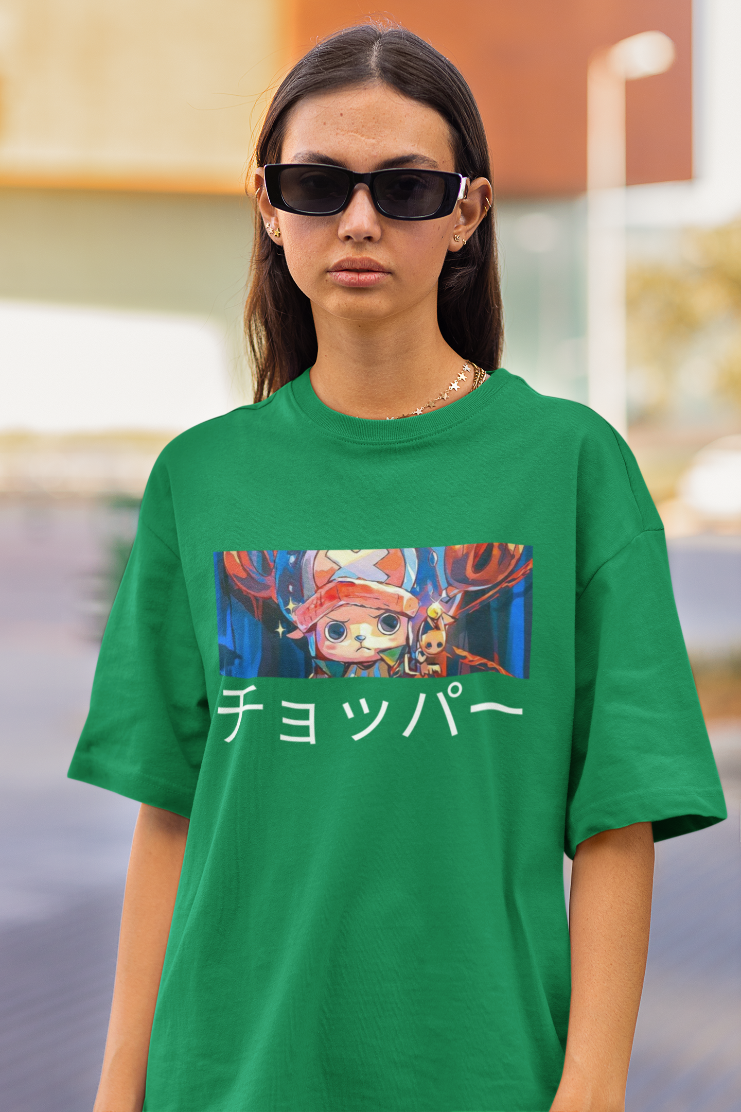 3rd front view a female model wearing a forest green oversized t-shirt featuring Tony Chopper from the One Piece anime.