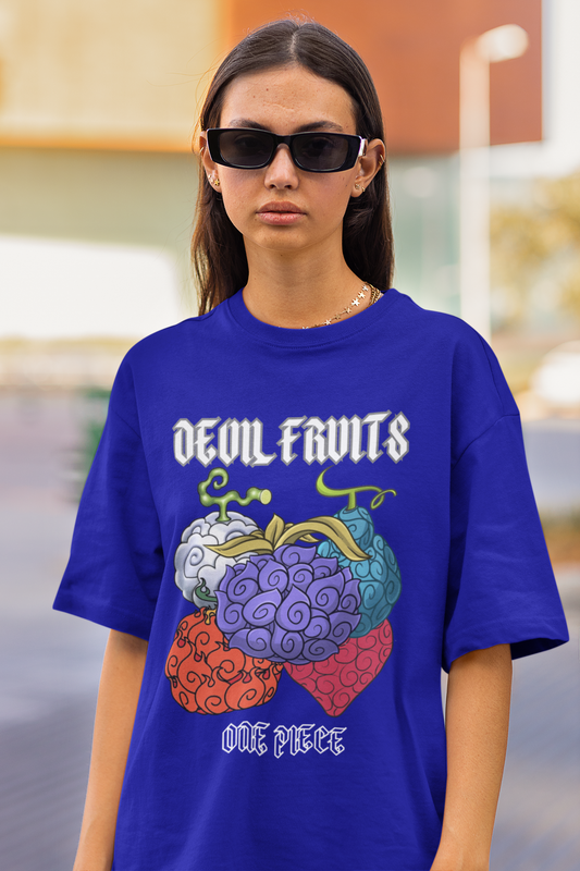 First front view of a female model wearing a royal blue oversized t-shirt featuring a design of a Devil Fruit from the One Piece anime.