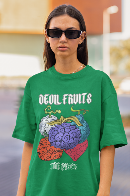 First front view of a female model wearing a forest green oversized t-shirt featuring a design of a Devil Fruit from the One Piece anime.