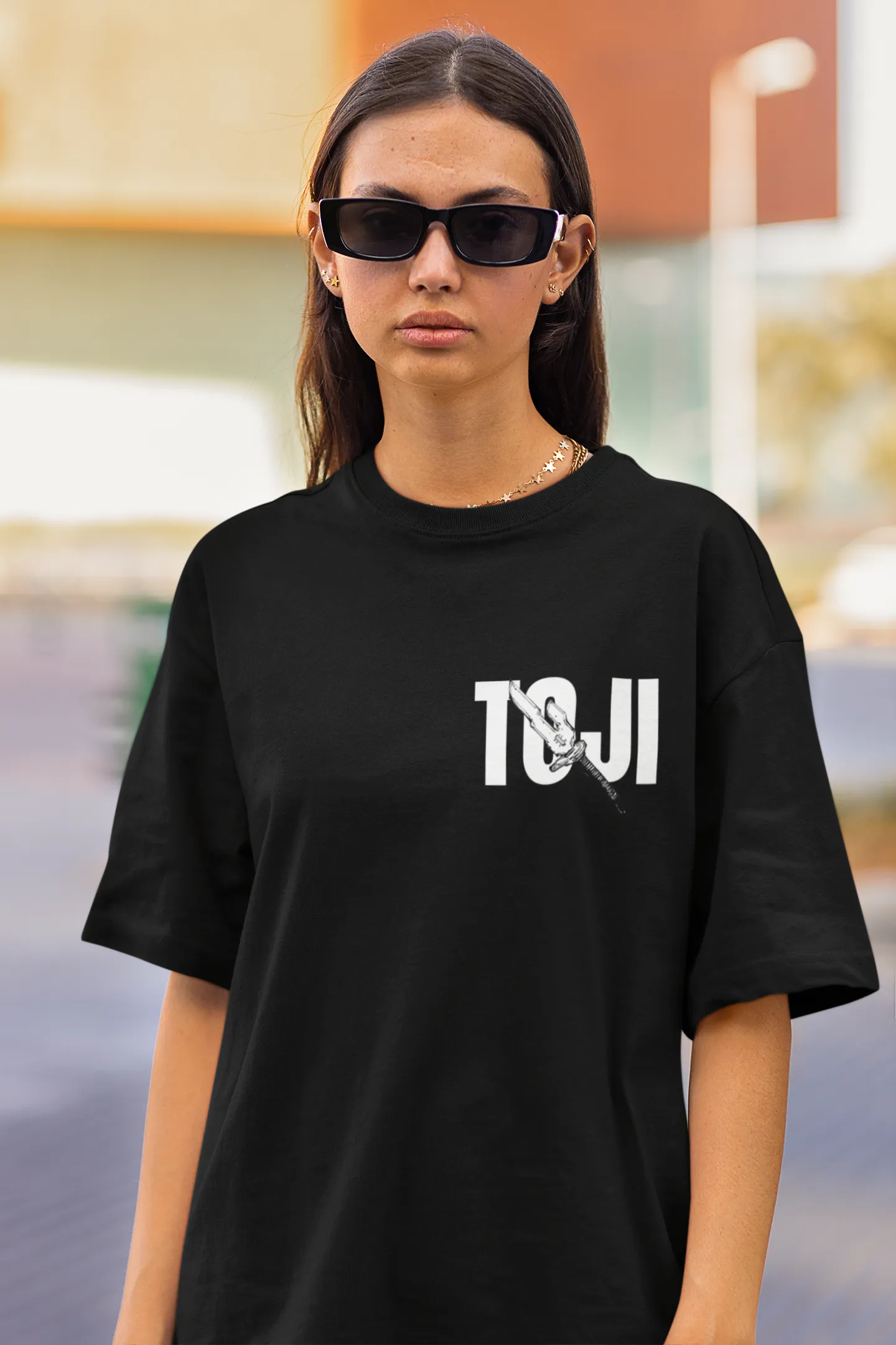 2nd front view of a female model wearing a black oversized t-shirt featuring Toji Fushiguro from the Jujutsu Kaisen anime.