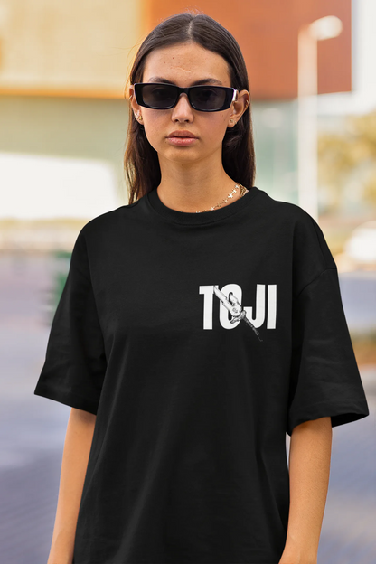 2nd front view of a female model wearing a black oversized t-shirt featuring Toji Fushiguro from the Jujutsu Kaisen anime.
