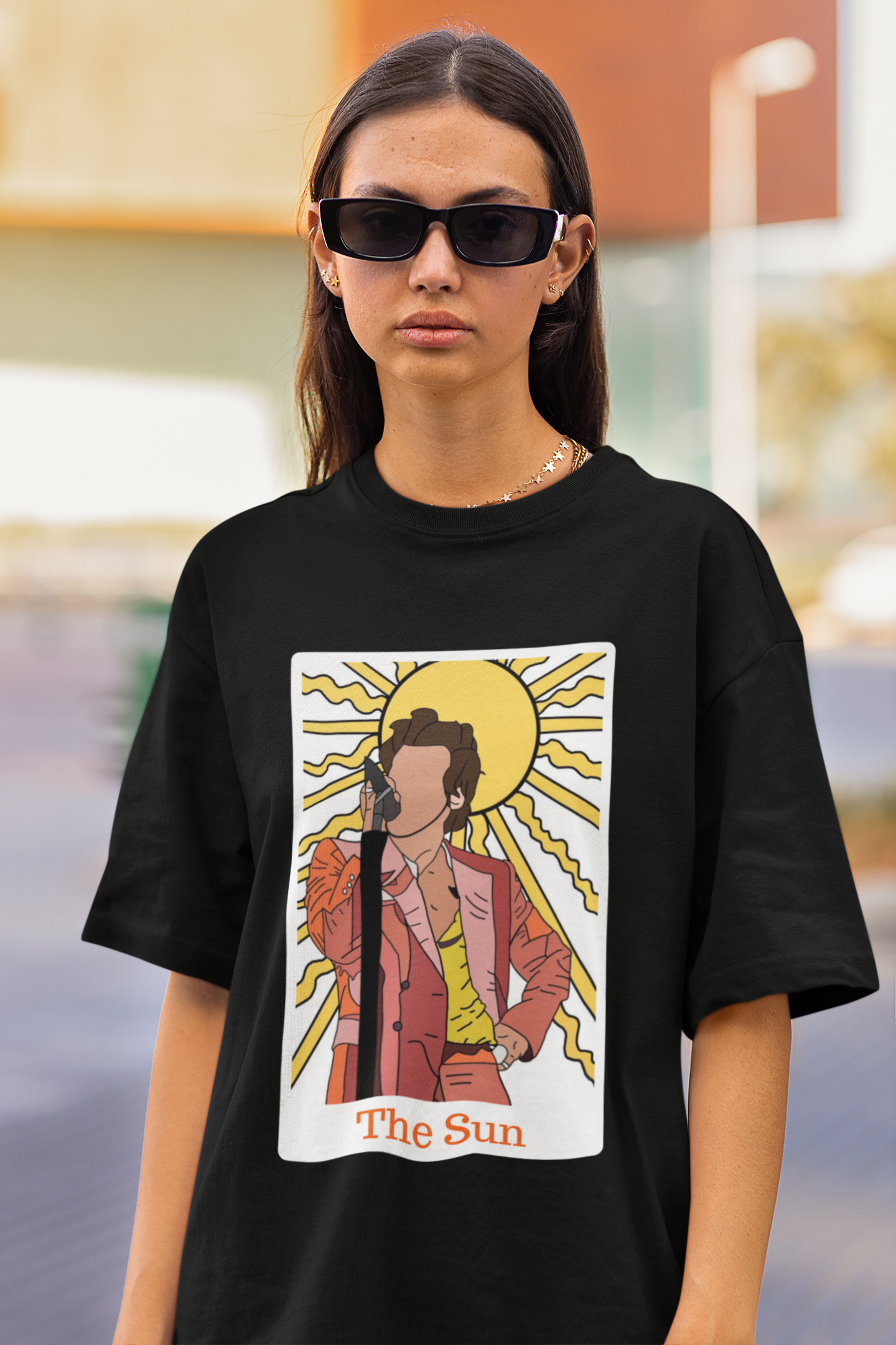 First Image of woman wearing black Oversized t-shirt inspired by 'The Sun' - perfect for fans of Harry Styles and One Direction