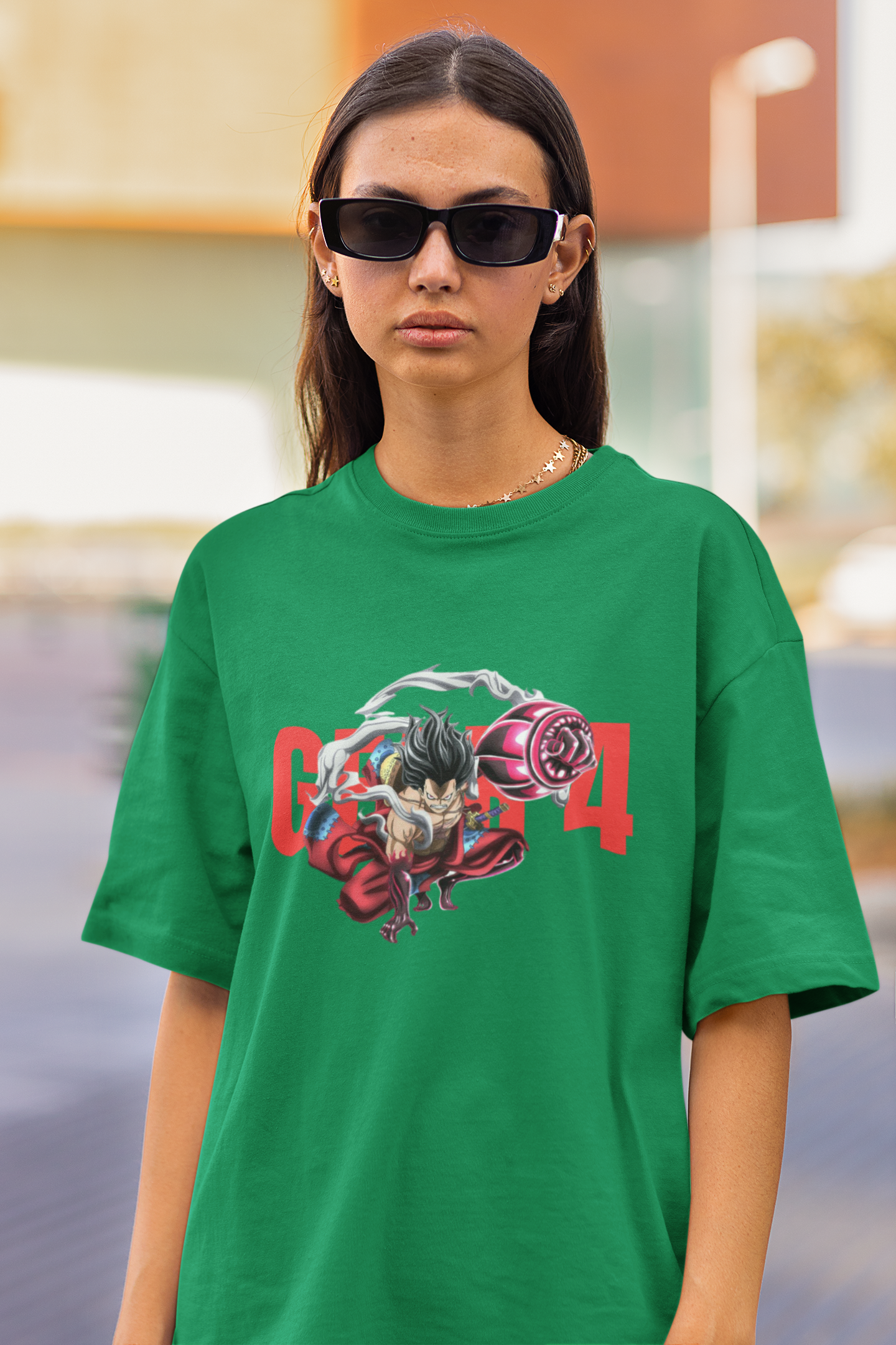 2nd front view of a female model wearing a forest green oversized t-shirt featuring Luffy in his Gear 4 Bounceman form from the One Piece anime.