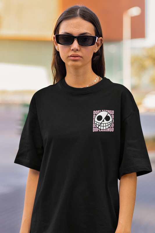 First front view of a female model wearing a black oversized t-shirt featuring Donquixote Doflamingo from the One Piece anime.