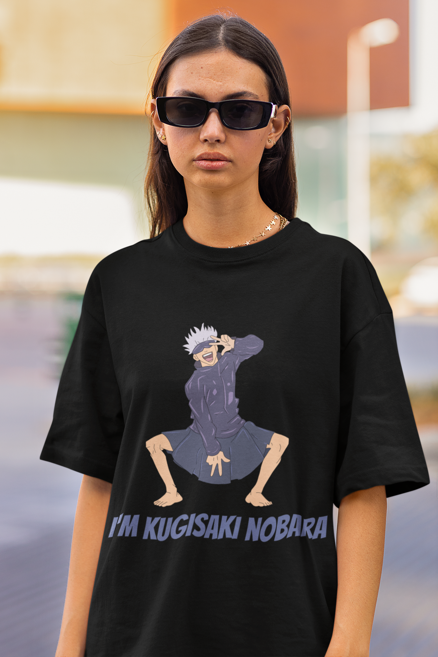 2nd front view of a female model wearing an black oversized t-shirt featuring Satoru Gojo dressed as Nobara Kugisaki.
