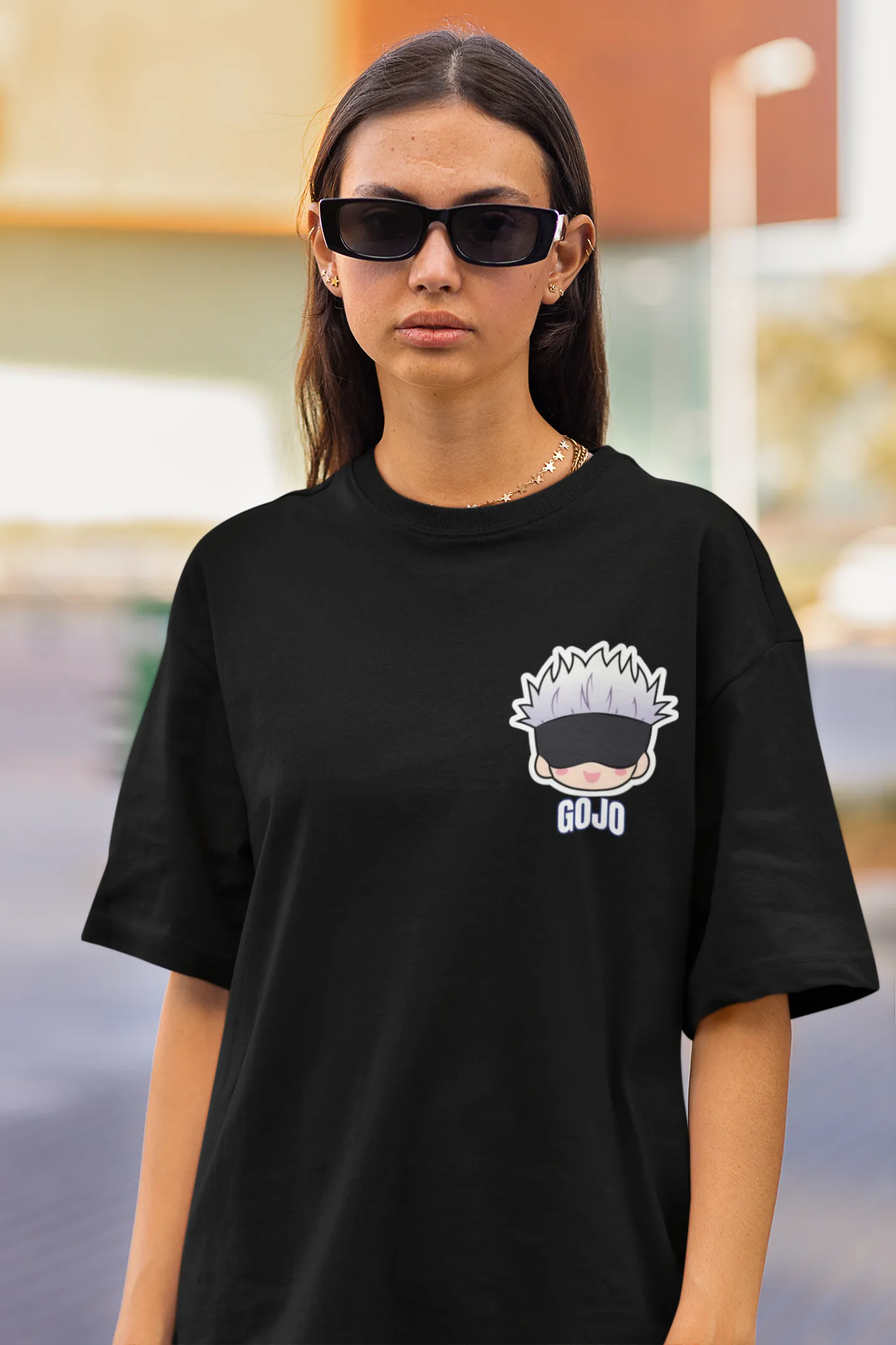 2nd front view of a female model wearing a black oversized t-shirt featuring Gojo Satoru from Jujutsu Kaisen with the text "Satoru Gojo."