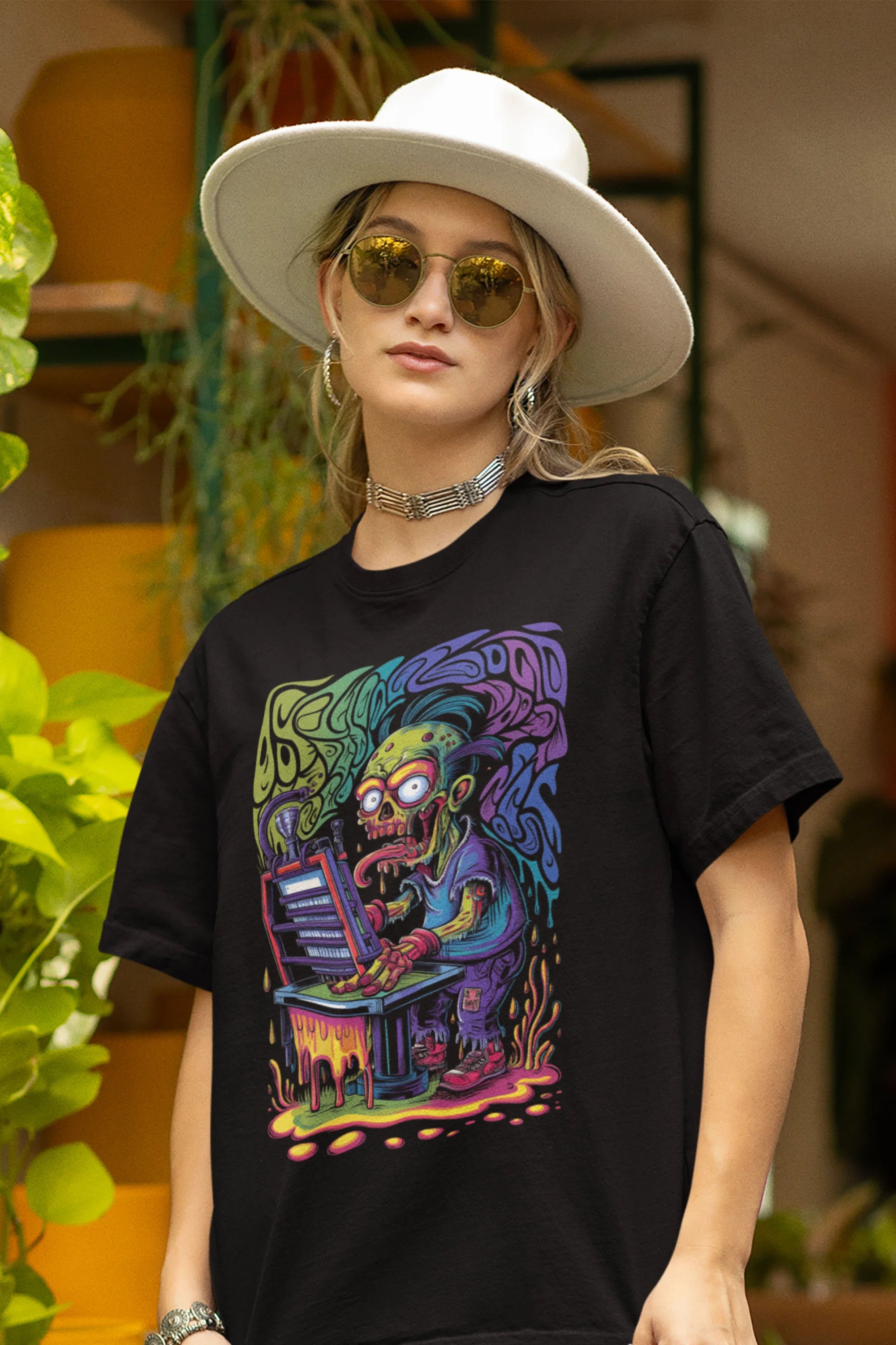 Front view of a female model wearing an black oversized t-shirt featuring a psychedelic melting green zombie design, perfect for a trippy, dark aesthetic.