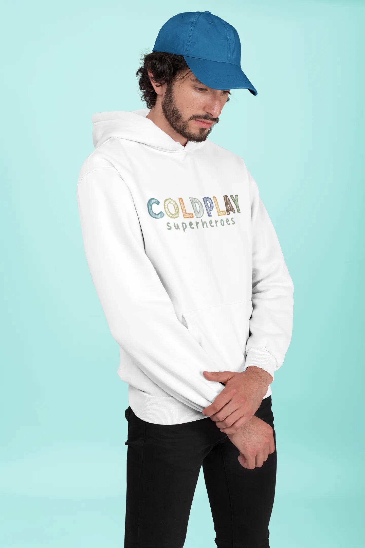 4th front view of a male model wearing an off-white hoodie with a design inspired by the "Something Just Like This" music video, featuring the word "Superheroes".