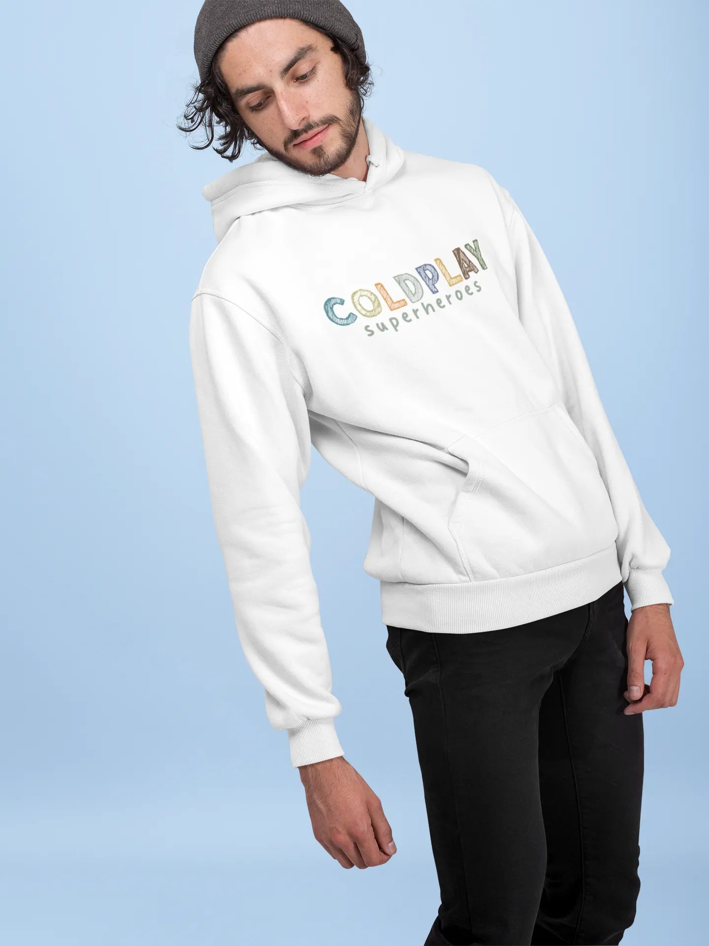 1st front view of a male model wearing an off-white hoodie with a design inspired by the "Something Just Like This" music video, featuring the word "Superheroes".