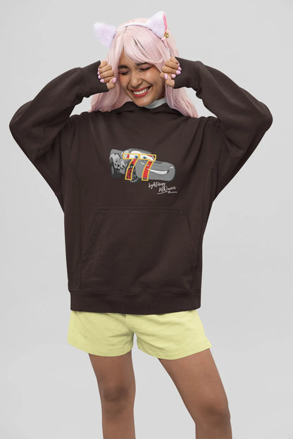 Front view of a female model wearing a chocolate brown hoodie with a Disney Cars design featuring Lightning McQueen and the number 77.
