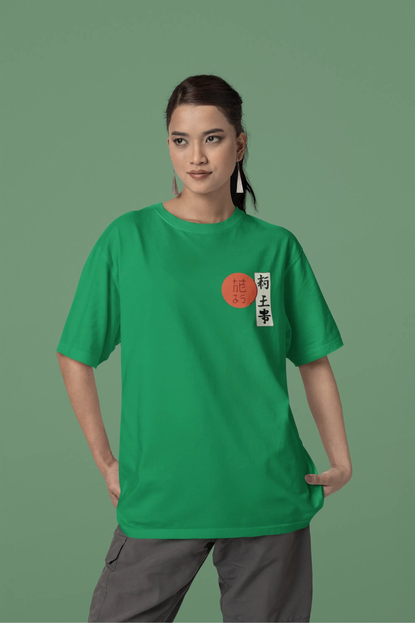 Front view of a male model wearing a forest green oversized tee with a design of a wolf surveying a Japanese landscape.
