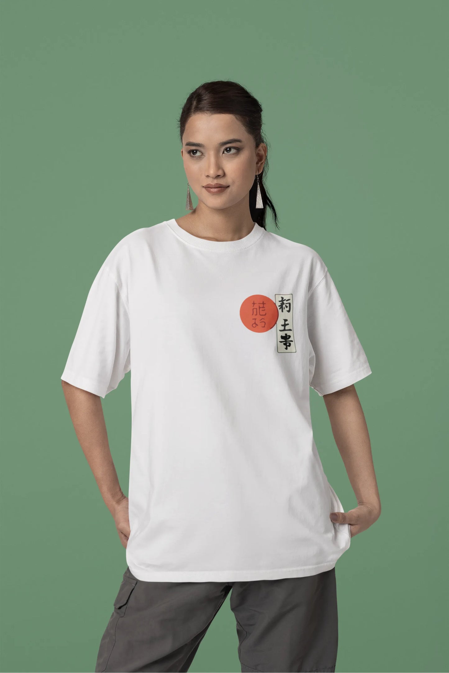 Front view of a female model wearing a off-white oversized tee with a design of a wolf surveying a Japanese landscape.