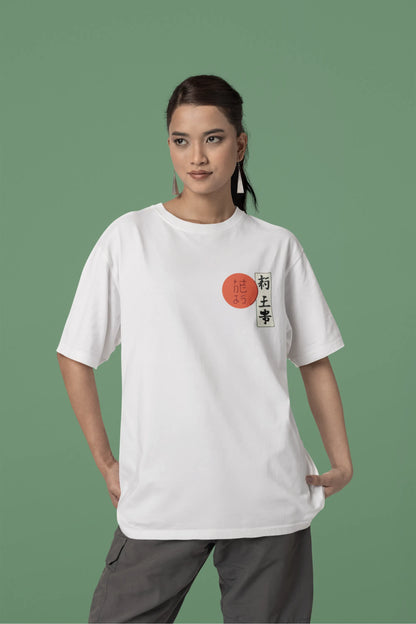 Front view of a female model wearing a off-white oversized tee with a design of a wolf surveying a Japanese landscape.