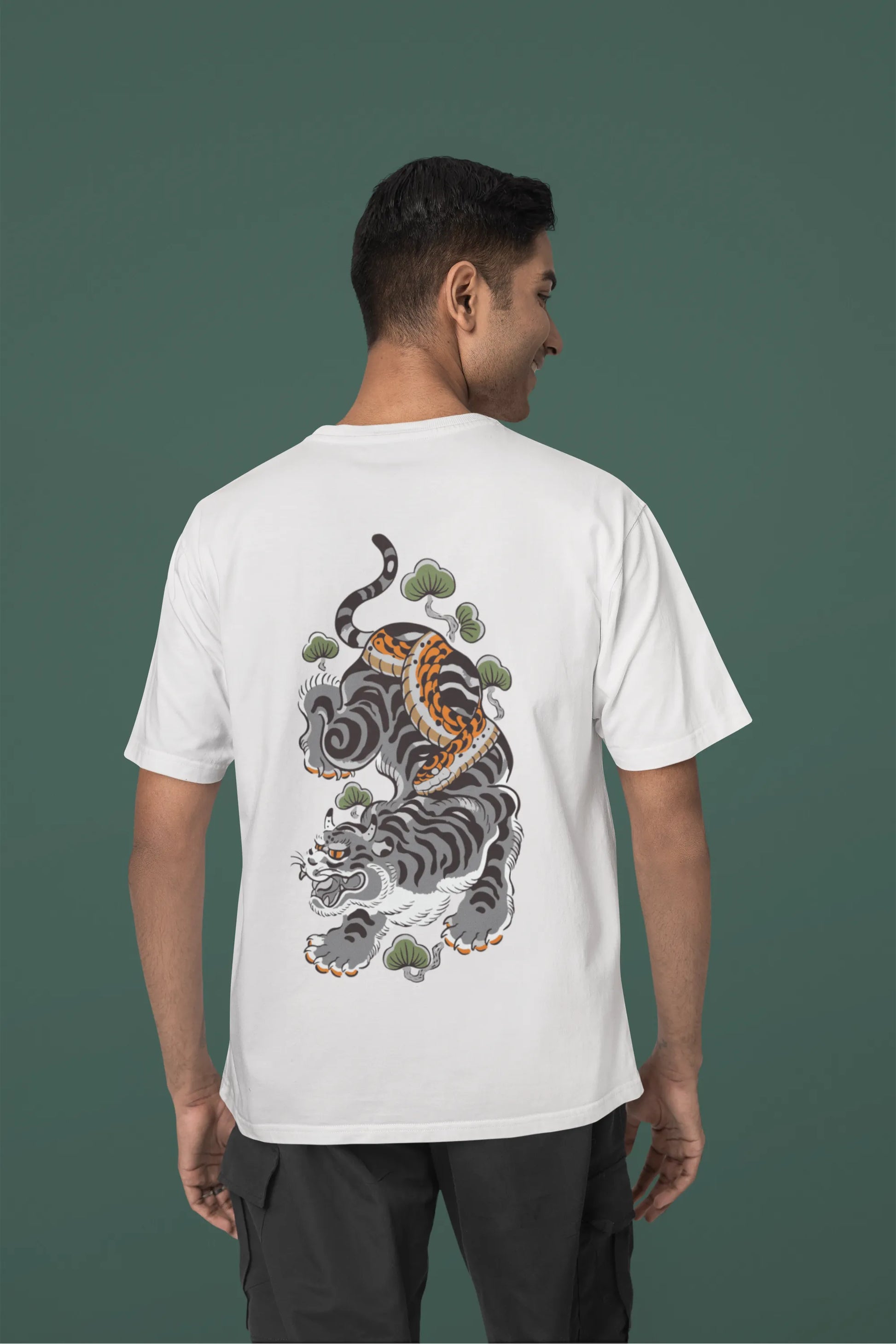 Back view of a male model wearing a off-white oversized tee with a Japanese art style tiger design.
