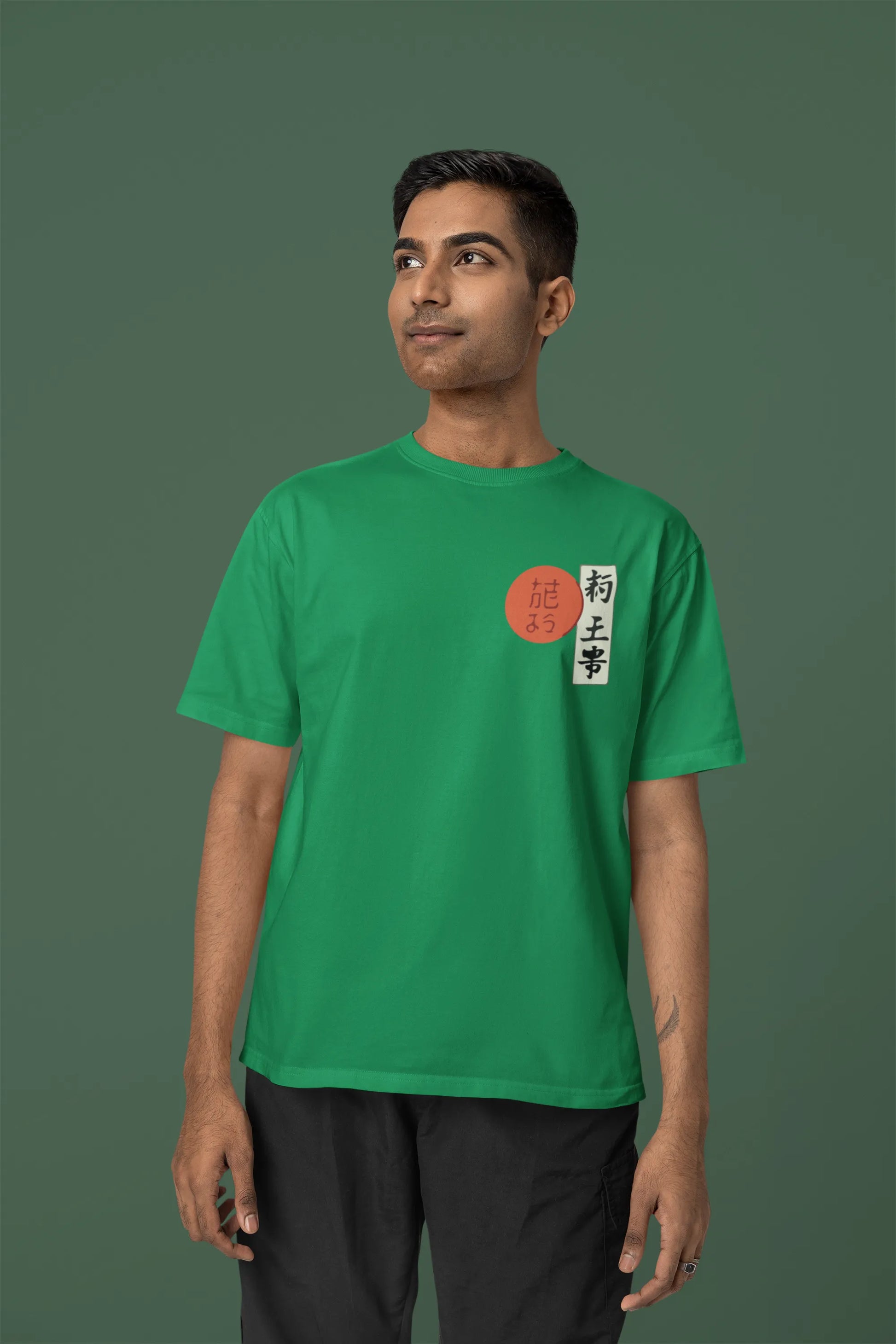Front view of a male model wearing a forest green oversized tee with a design of a wolf surveying a Japanese landscape.