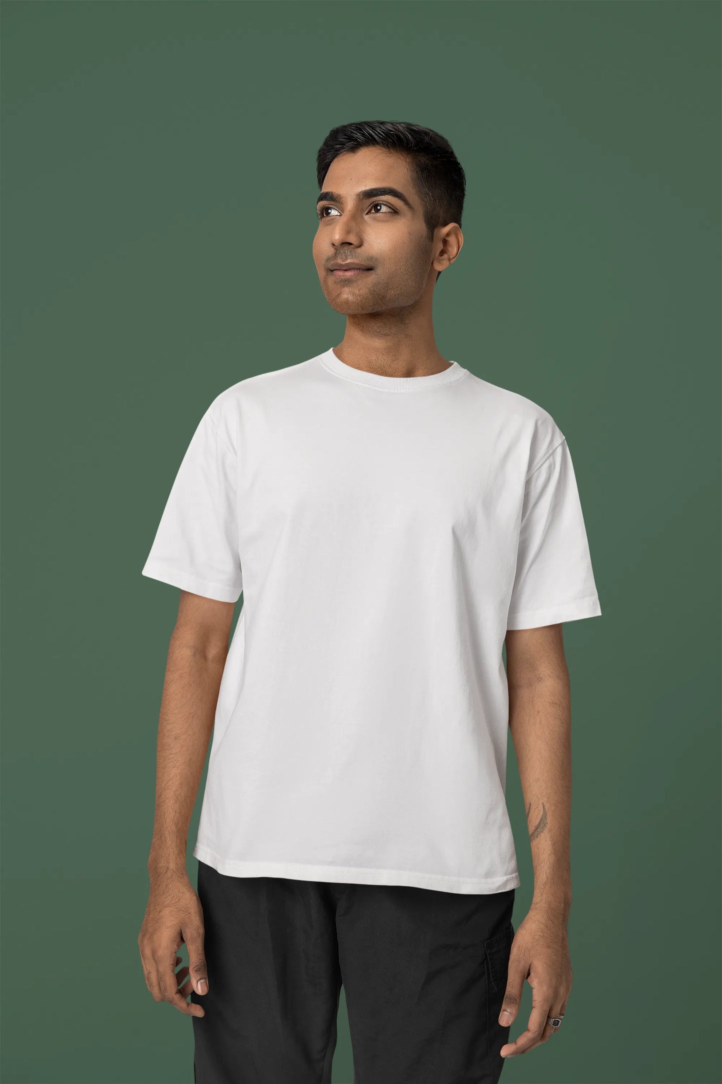 Front view of a male model wearing a off-white oversized tee with a Japanese art style tiger design.