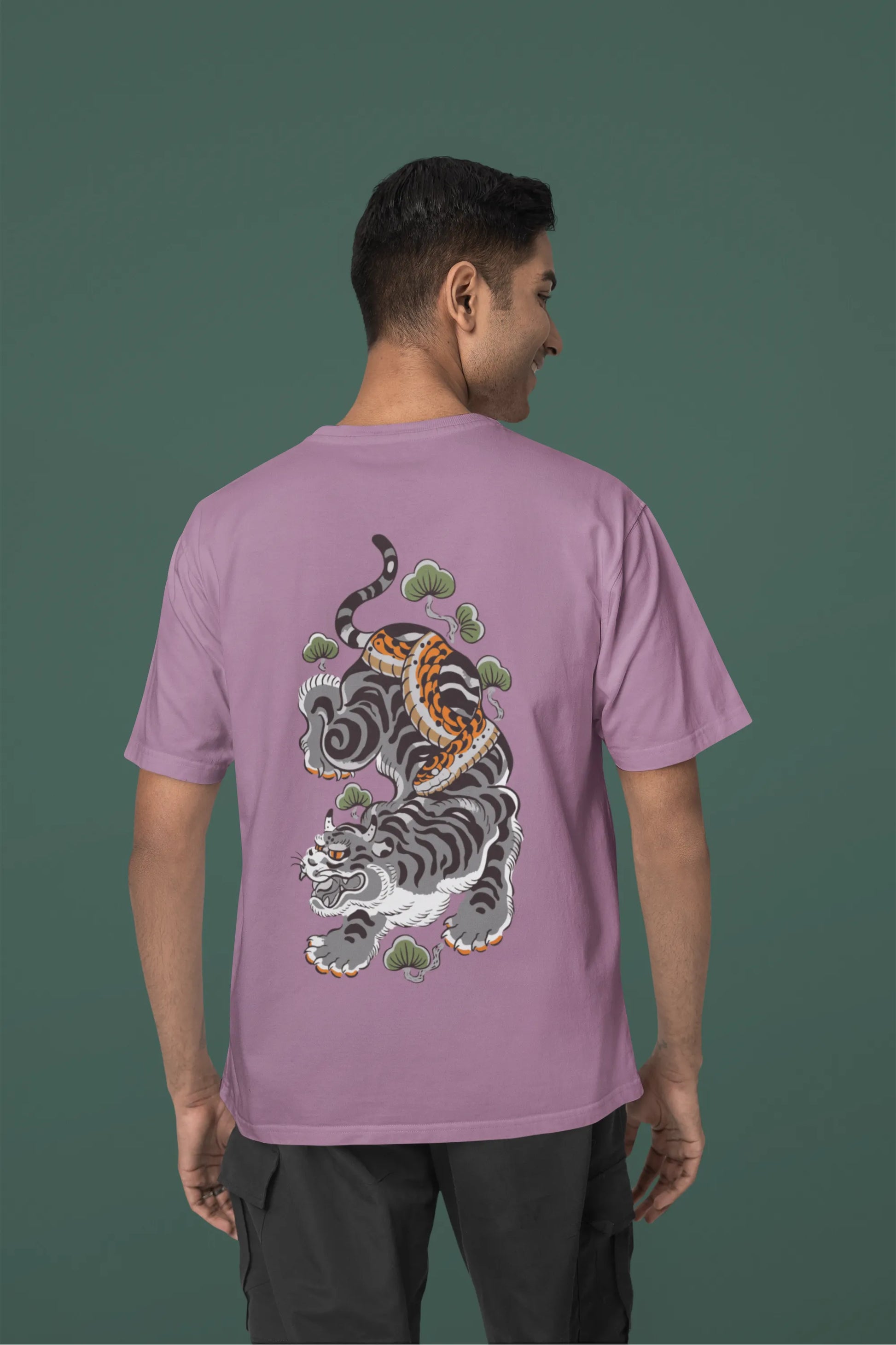 Back view of a male model wearing a dirty purple oversized tee with a Japanese art style tiger design.