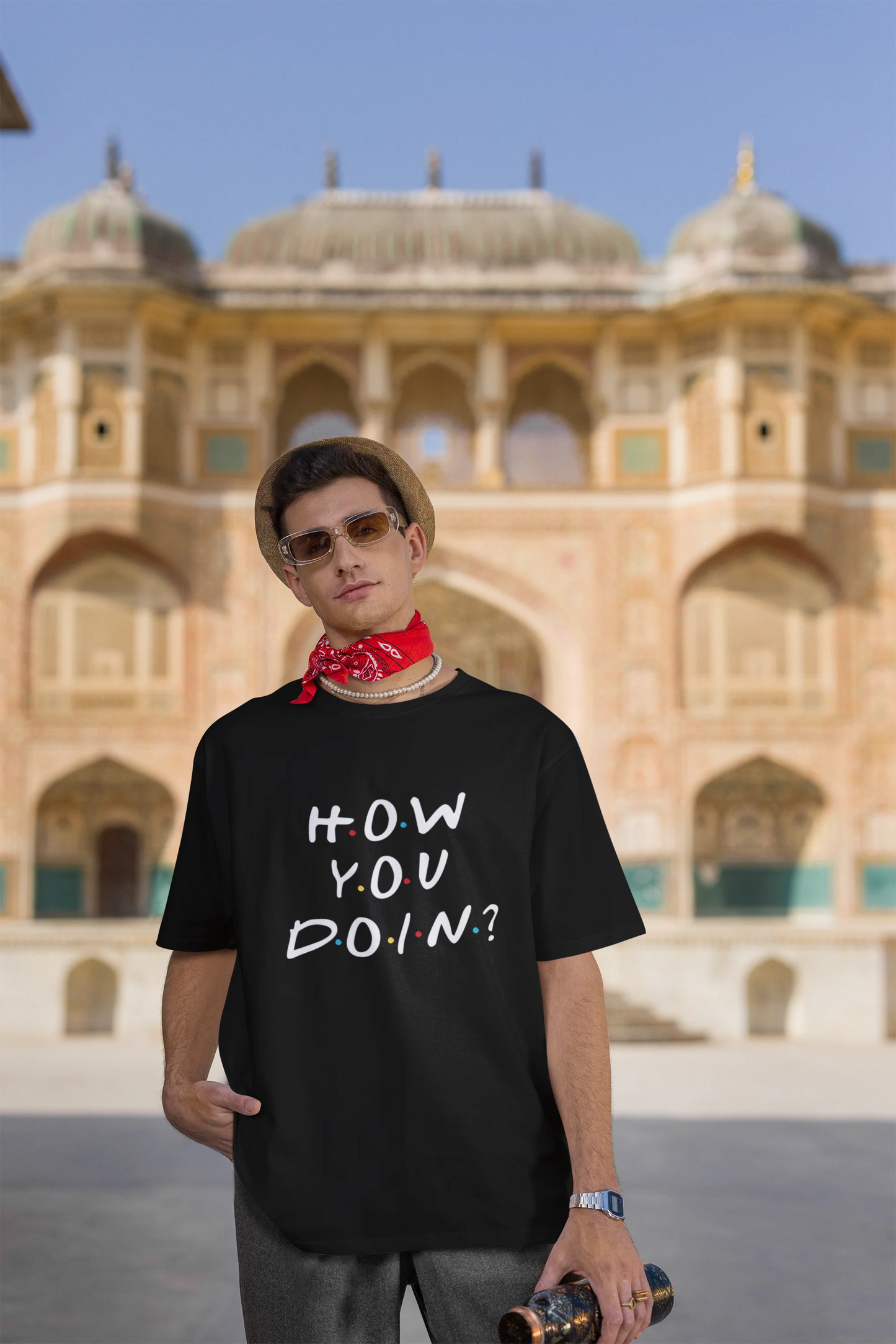 Third image of female model wearing black oversized t-shirt with F.R.I.E.N.D.S series inspired designs, embodying Joey's famous catchphrase 'How You Doin'?