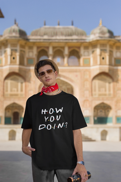 Third image of female model wearing black oversized t-shirt with F.R.I.E.N.D.S series inspired designs, embodying Joey's famous catchphrase 'How You Doin'?