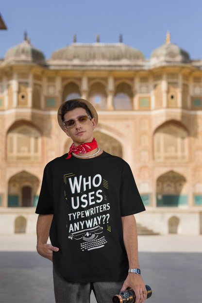 Third Image of man wearing black Oversize t-shirt featuring TTPD design inspired by Taylor Swift's Eras Tour.