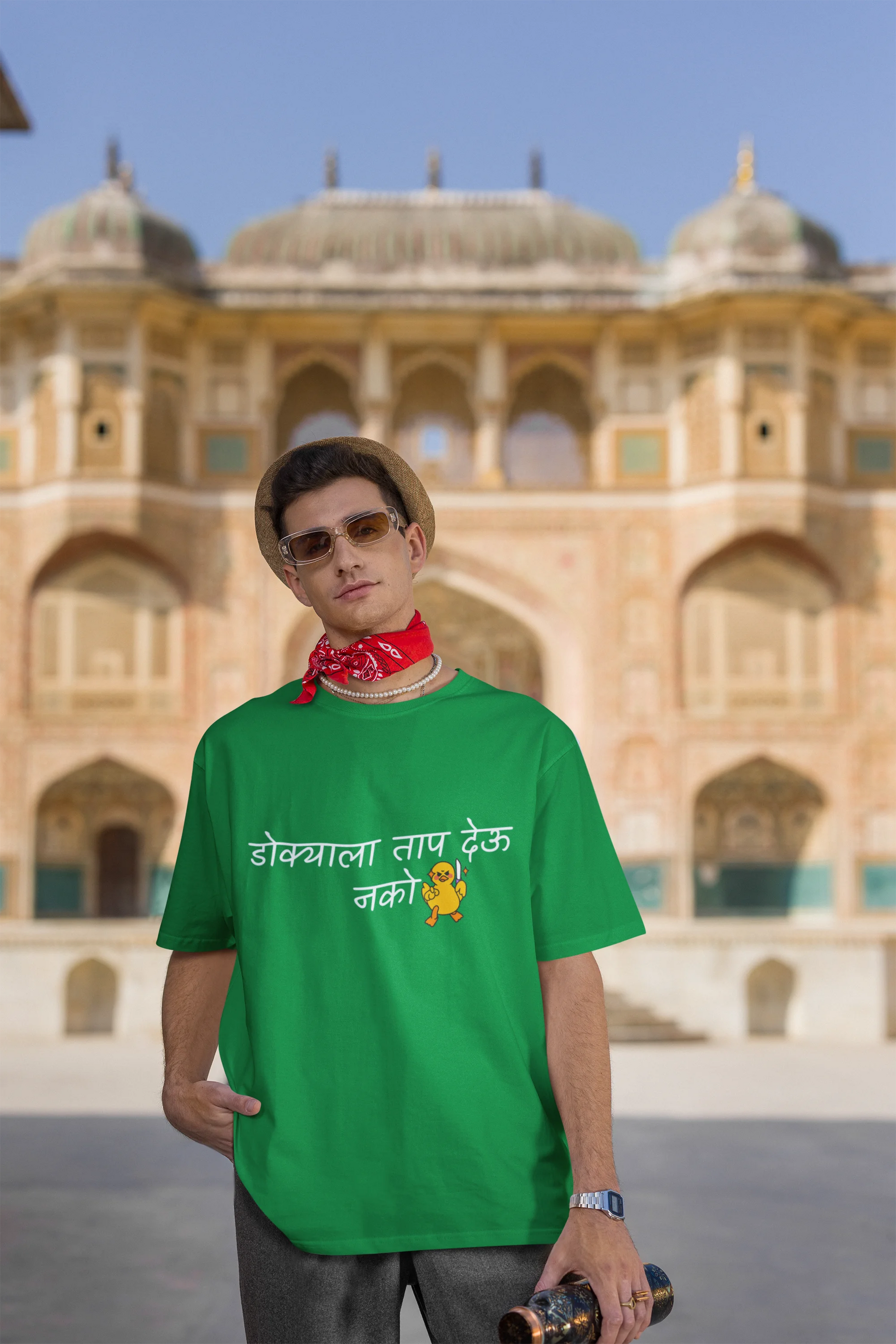Third front view of a male model wearing a forest green oversized t-shirt featuring a design inspired by Marathi culture. Perfect for anyone who loves Maharashtra and its vibrant traditions.