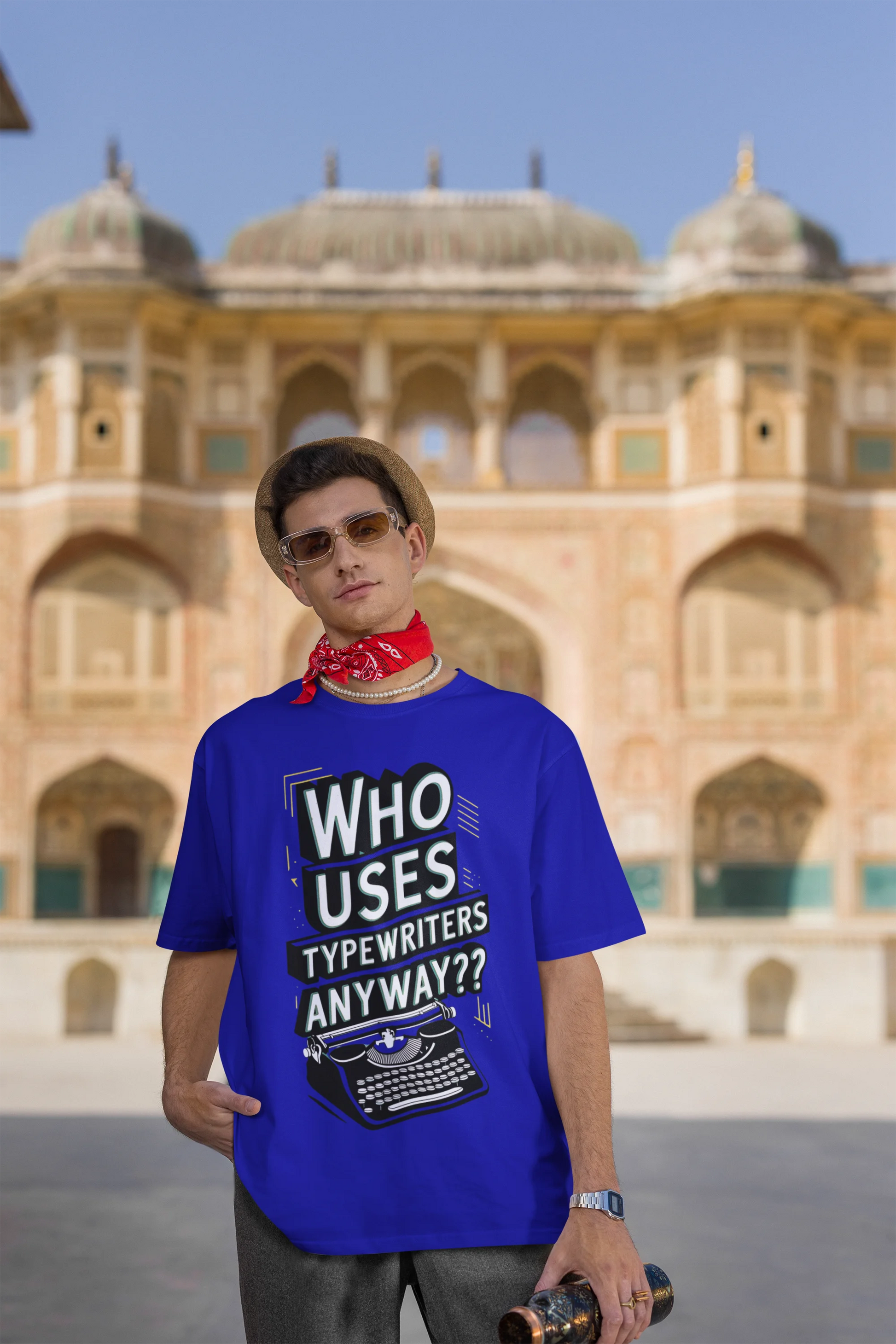 Third Image of man wearing blue Oversize t-shirt featuring TTPD design inspired by Taylor Swift's Eras Tour.