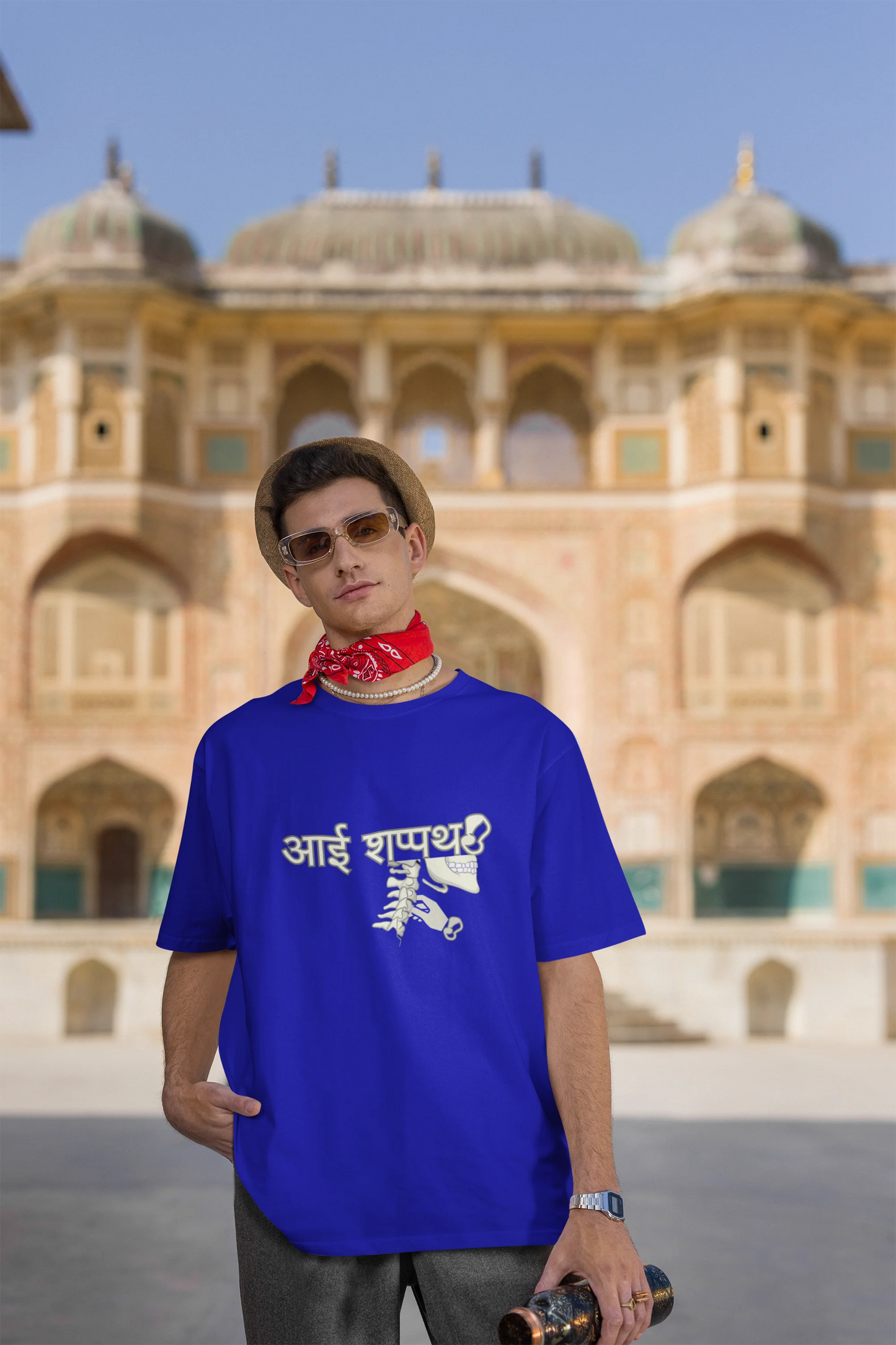 Third front view of male model wearing a royal blue oversized t-shirt featuring a design inspired by the Marathi saying "Aai Sapath." Perfect for fans of Marathi culture and anyone who wants to celebrate their heritage.