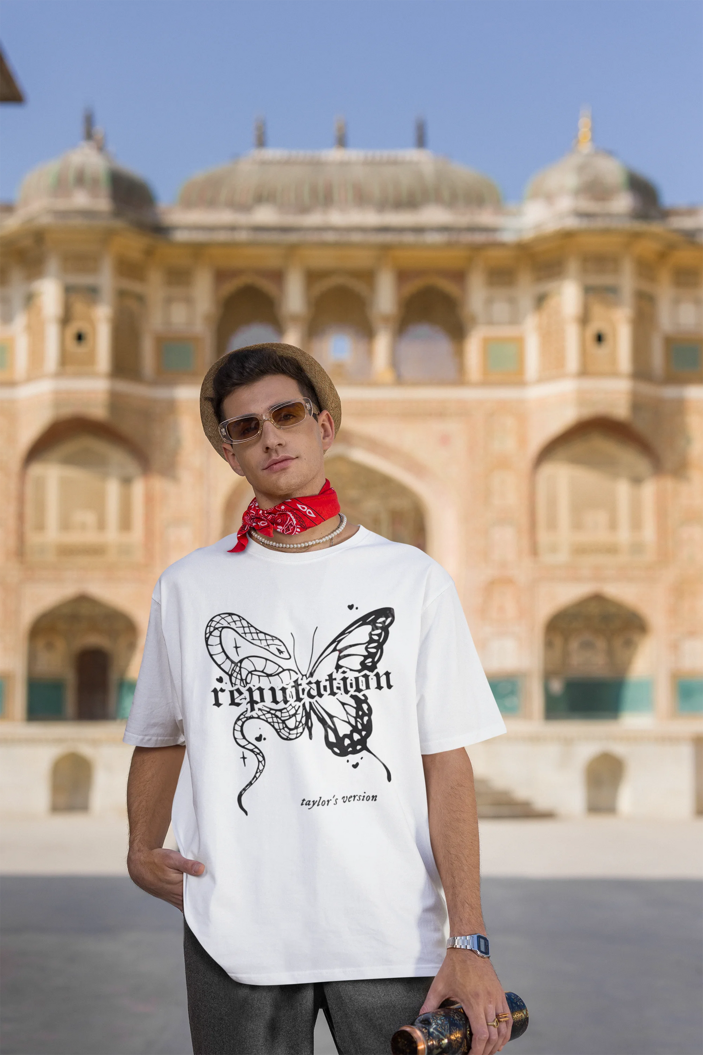 Third Image of a man wearing white Oversize t-shirt featuring Reputation Taylor's Version design inspired by Taylor Swift's Reputation era