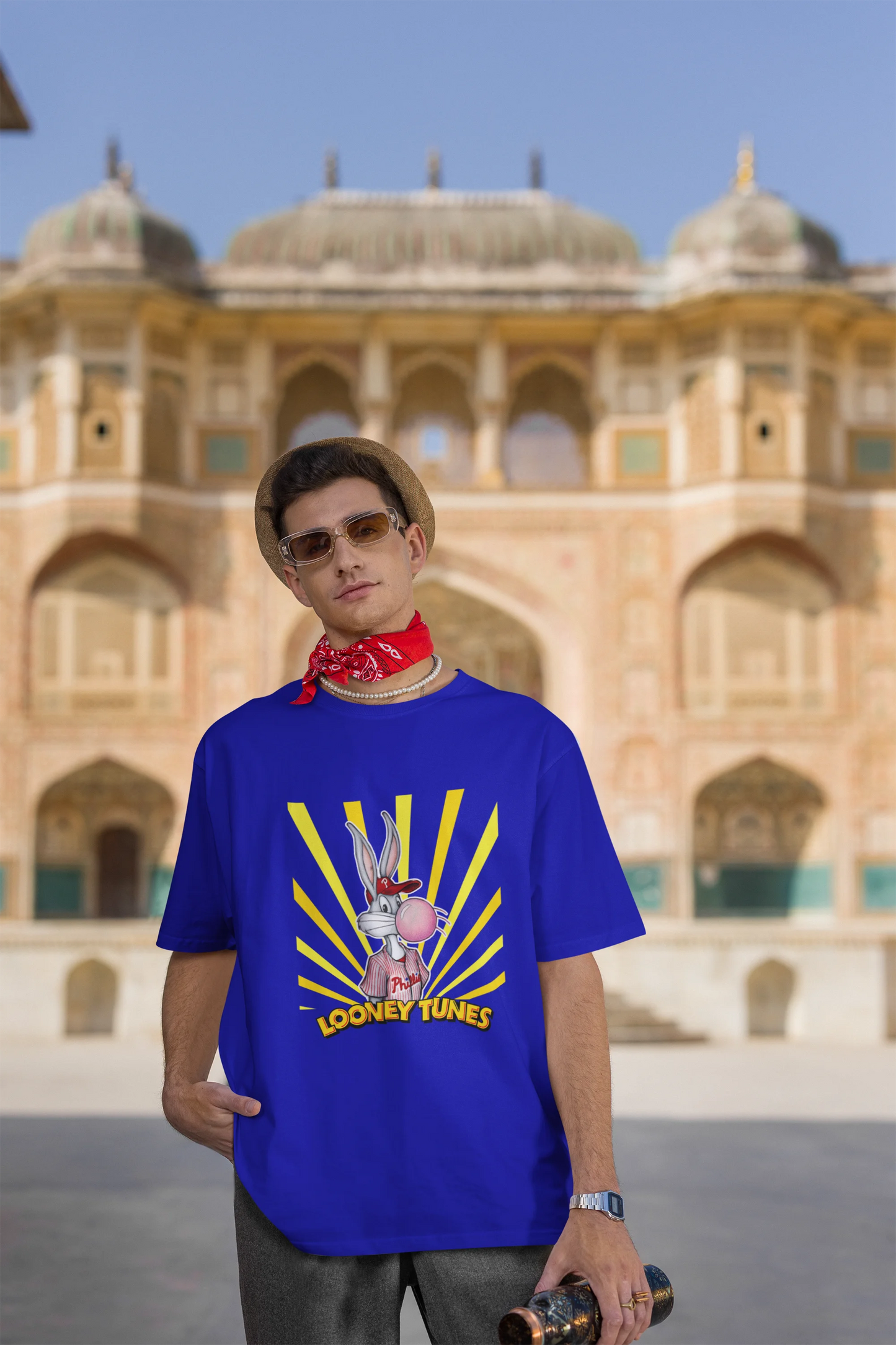Third image of male Model showcasing blue Bugs Bunny oversize t-shirt from Looney Tunes, featuring a bold Bugs Bunny design