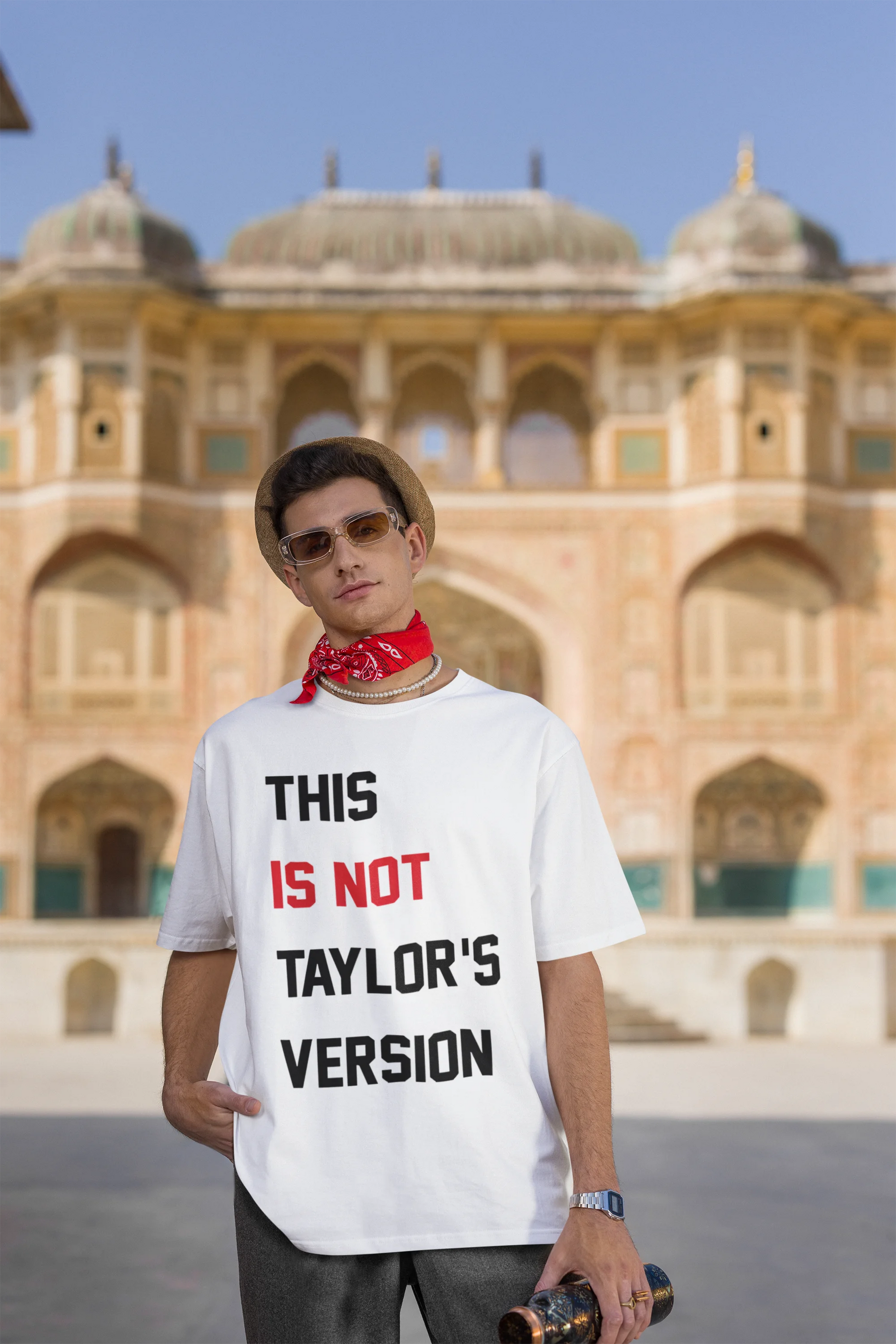 Third image of Woman wearing Taylor Swift Red-themed oversized tee, showcasing iconic eras tour merch and Taylor's Version nod