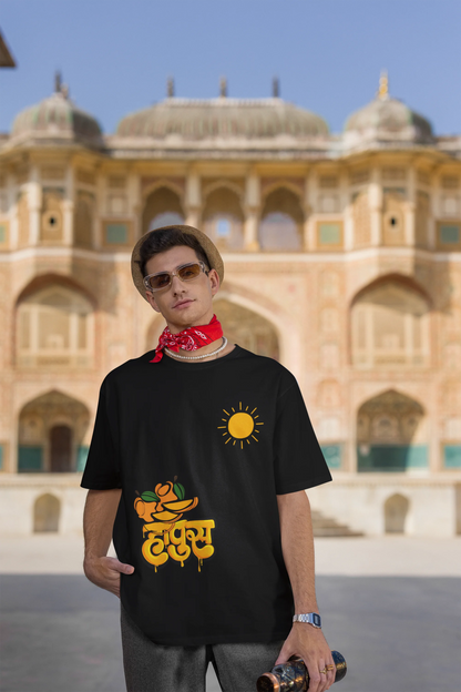 Second front view of male model wearing an black oversized t-shirt featuring a design inspired by the Marathi word "Hapus," meaning Alphonso mango. Ideal for fans of Marathi culture, foodies, and anyone who loves the king of fruits.