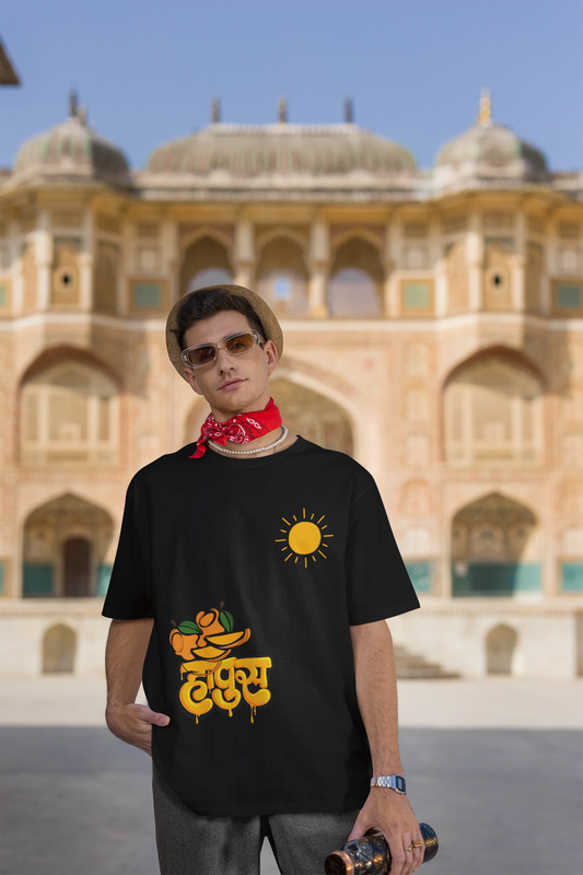 Second front view of male model wearing an black oversized t-shirt featuring a design inspired by the Marathi word "Hapus," meaning Alphonso mango. Ideal for fans of Marathi culture, foodies, and anyone who loves the king of fruits.