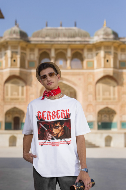 3rd front view of a male model wearing an off-white oversized t-shirt featuring Guts from the Berserk anime with the text "Berserk" across the design.
