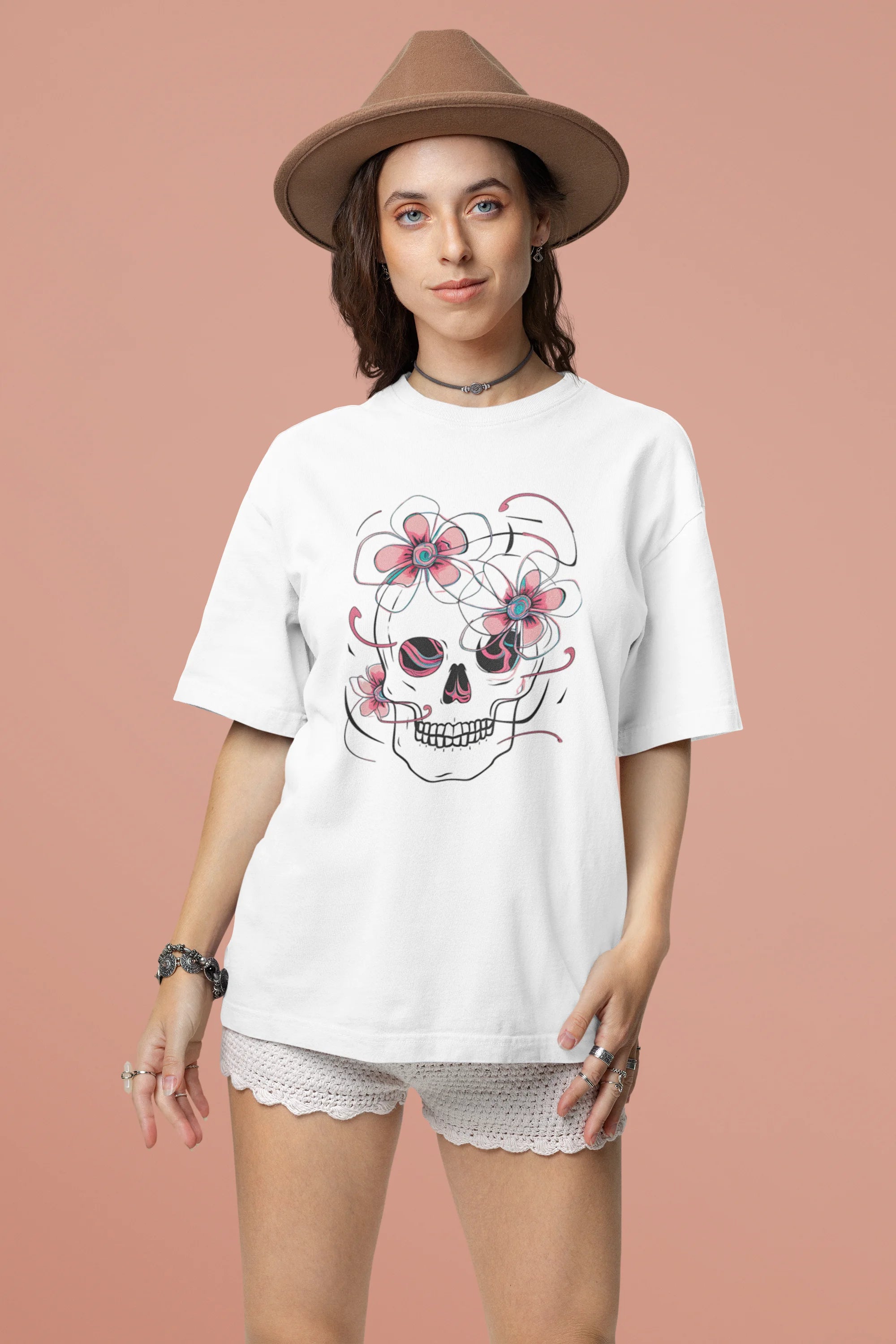 Second front view of female model wearing an off-white oversized t-shirt with a psychedelic skull flower design, perfect for a hippie, trance, or groovy style.